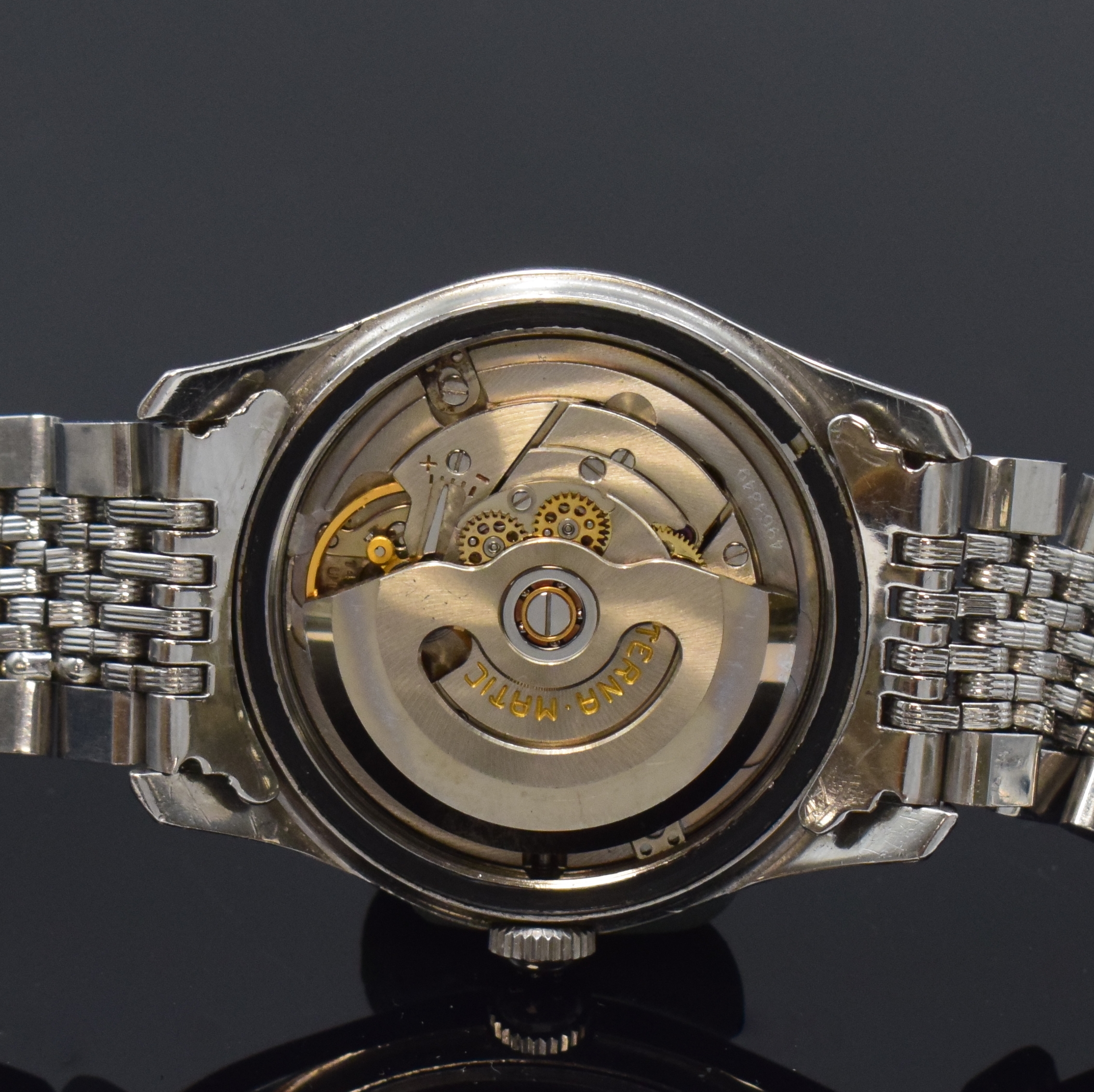 Detail f: ETERNA Kontiki Referenz 130T Herrenarmbanduhr in Stahl/Stahlband, Schweiz um 1960, Automatik, verschr. Geh., Boden m. Kontiki Gold-Plakette, orig. ...