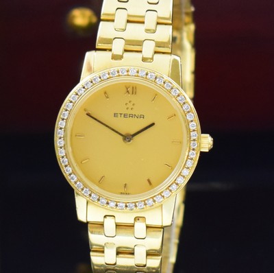 26797163a - ETERNA 18k yellow gold ladies wristwatch with diamonds set bezel reference 3600.71, quartz, snap on case back and diamond bezel, bracelet with butterfly buckle, gilded dial, display of hours and minutes, calibre ETA 976.001, diameter approx. 25 mm, length approx. 17,5 cm, original papers, invoice copy and box without inlay, sold in August 1993, condition 2-3, weight approx. 72g