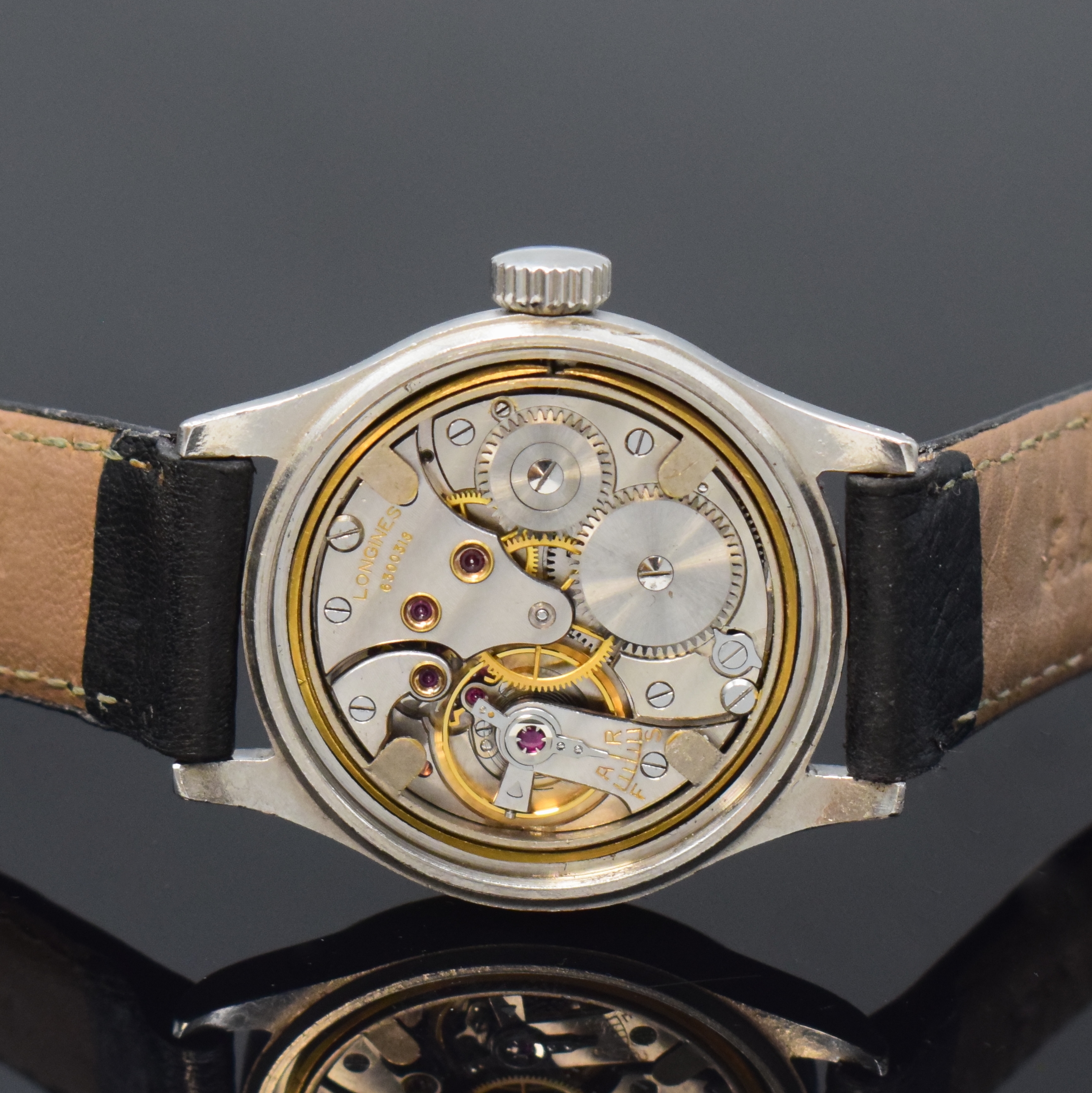 Detail d: LONGINES Tre Tacche Herrenarmbanduhr in Stahl, Schweiz um 1942, Handaufzug, gestuftes Geh., Boden verschr., Krone später, silb. Zifferbl. pat., ...