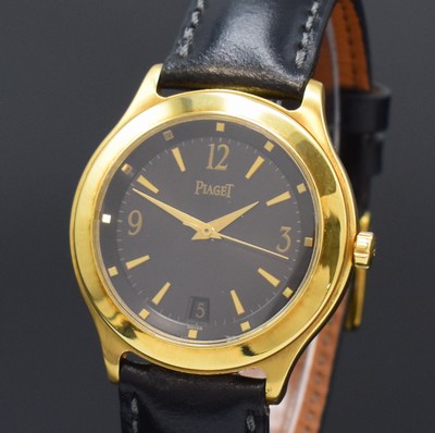 26797302a - PIAGET Citea wristwatch in 18k yellow gold reference 26001, self winding, case back 6- times screwed, black dial with gilded hour- indices and Arabic numerals, gilded hands, date at 6, rhodium plated movement calibre 197P with fausses cotes decoration, 27 jewels, diameter approx. 35 mm, condition 2