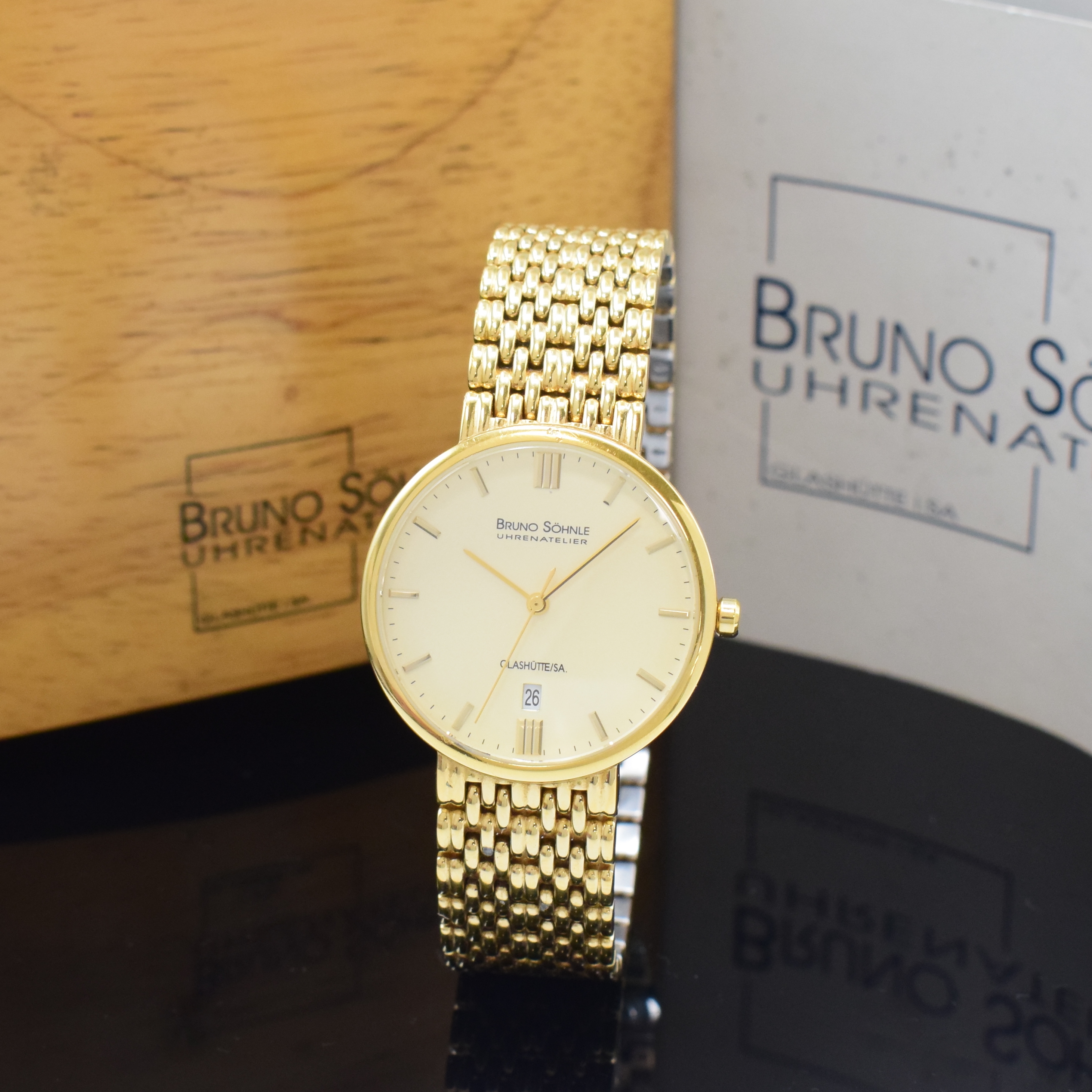 BRUNO SÖHNLE Nabucco vergoldete Armbanduhr, Deutschland um 2005, quarz, verg. Gliederband m. dopp. Faltschl., Boden gedr., Saphirglas, cremefarb. ...