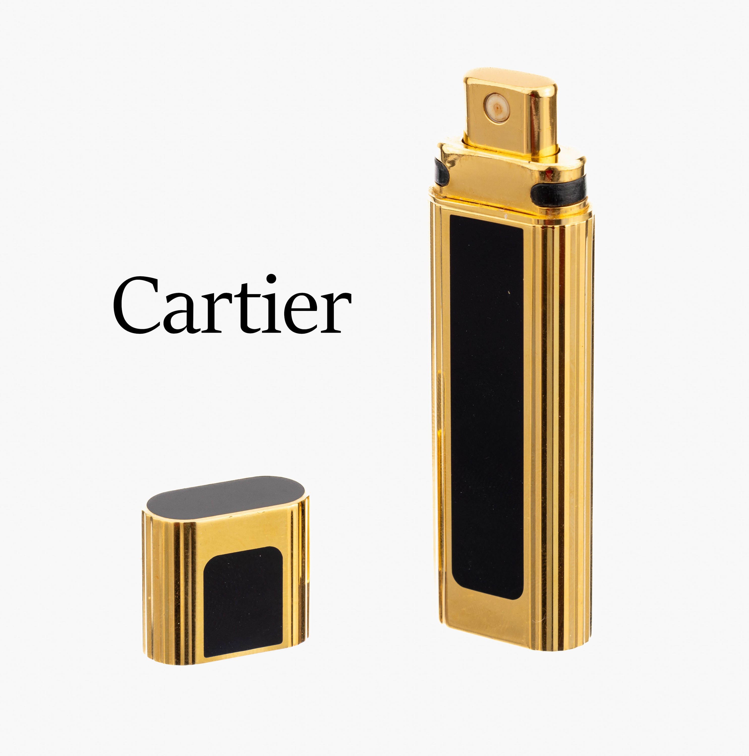 CARTIER-Taschenparfümflakon, Metall vergoldet, schwarze Lackeinlagen, L. ca. 9 cm
