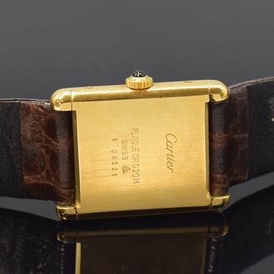 26801432c - CARTIER Tank ladies wristwatch, manual winding, gold-plated silver case, jeweled crown, case at the sides 4-times screwed down, champagne coloured dial with Roman numerals, blued steel hands, calibre 78-1 (base calibre ETA 2512-1) with fausses cotes decoration, 17 jewels, measures approx. 31 x 24 mm, condition 2-3