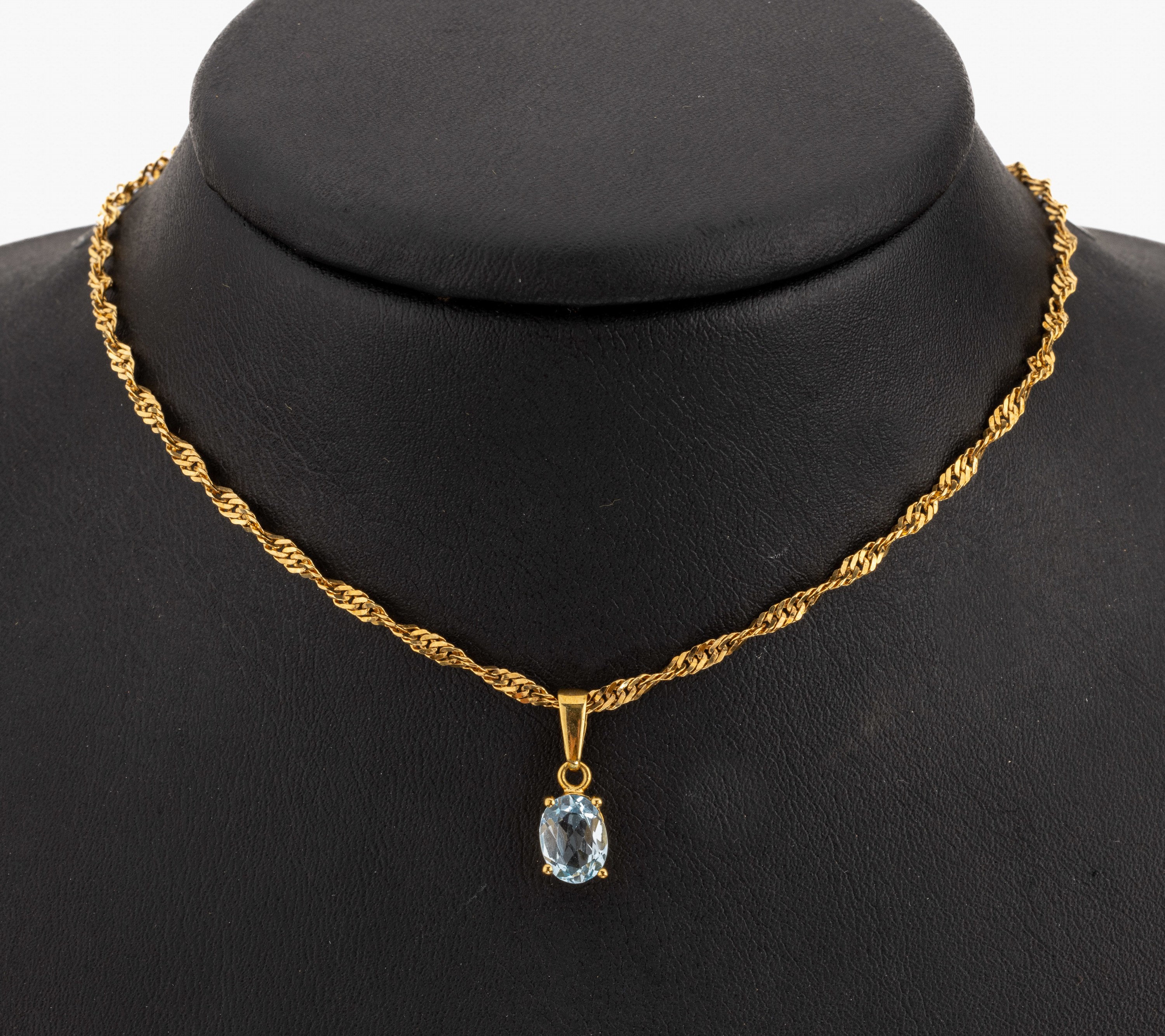 8 kt Gold Farbstein-Anhänger, GG 333/000, ovalfacett. Blautopas (beh.) ca. 1.20 ct, an gekordelter 14 kt Gold Kette L. ca. 42 cm, ...