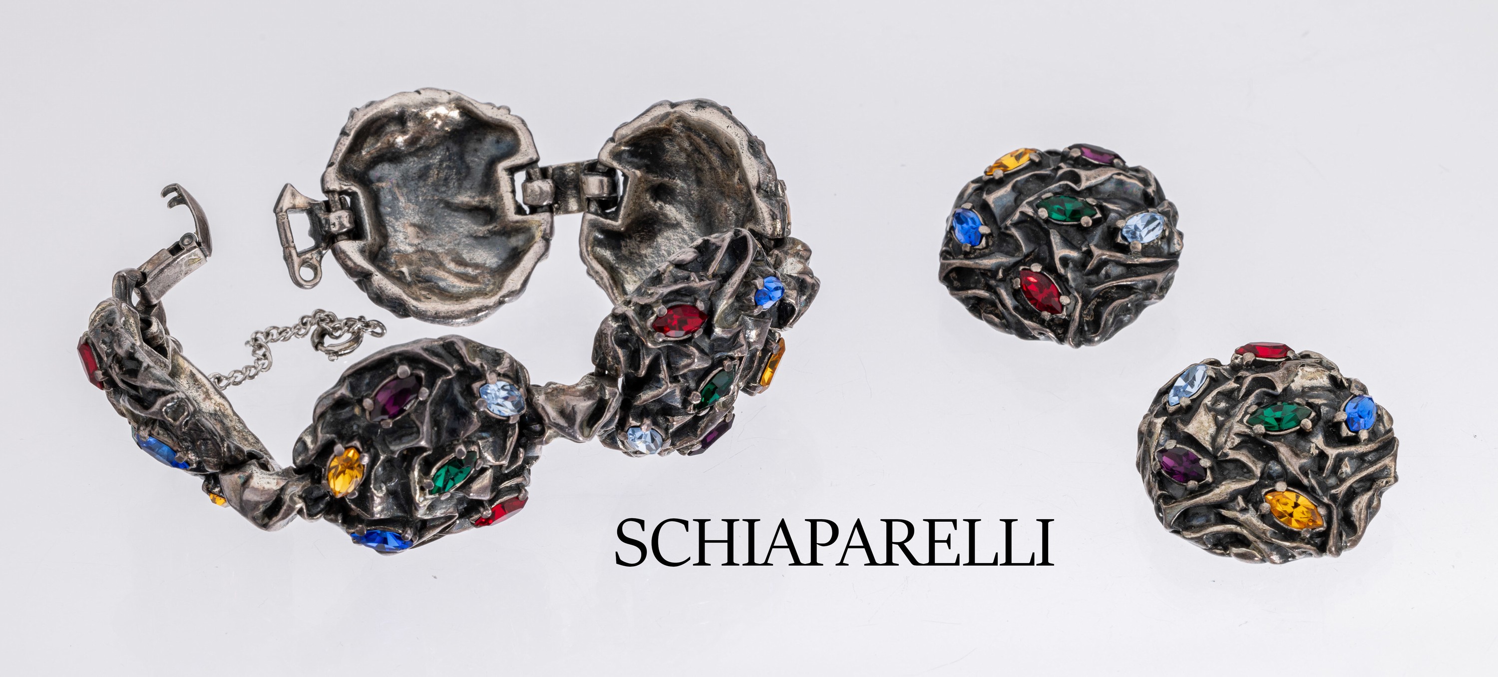 SCHIAPARELLI Schmuckset, USA um 1955, Metall versilbert, abstrakte Gestaltung, best.aus: Armband, L. ca. 19.5 cm, ...