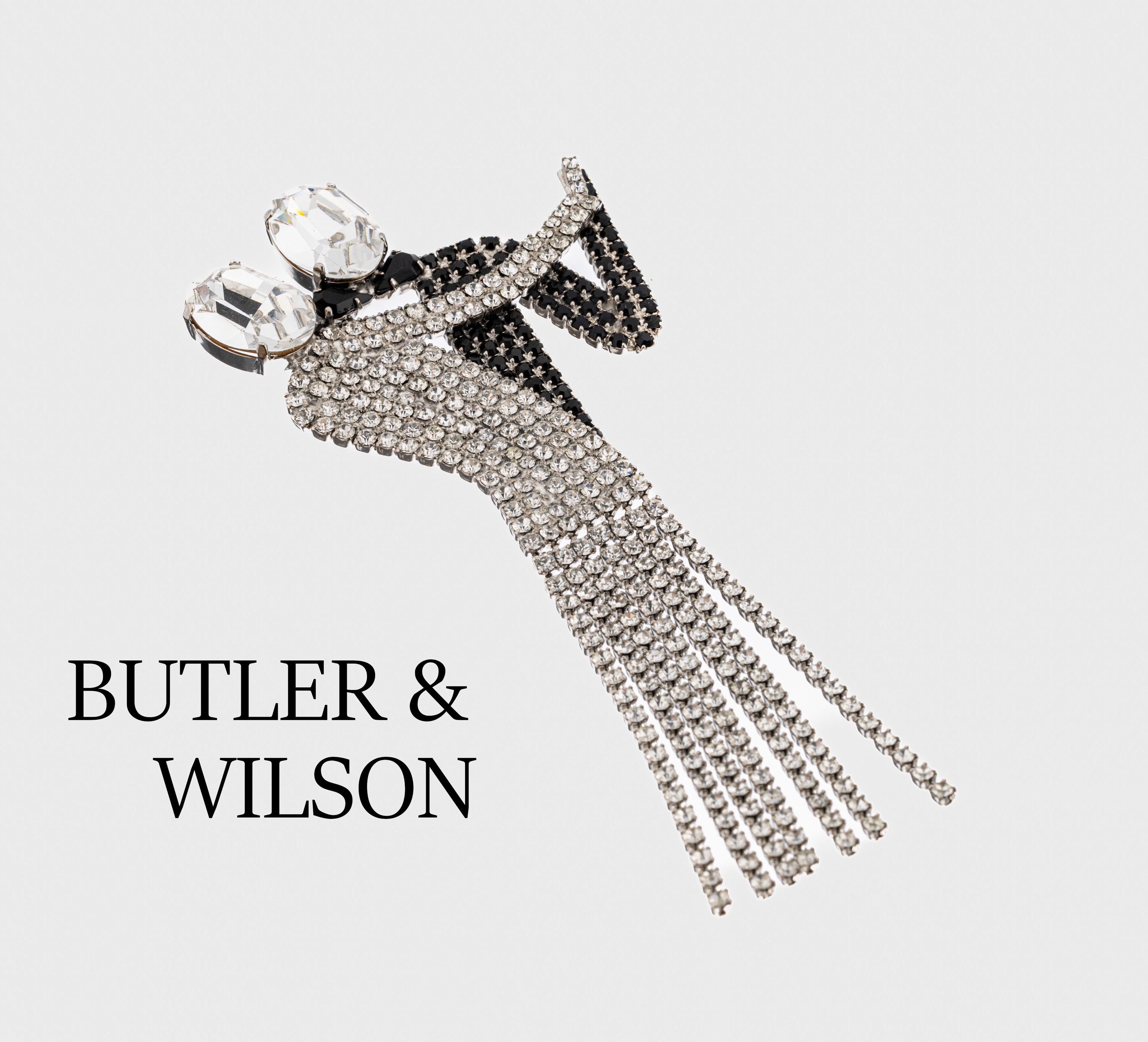 Außergewöhnliche Brosche "Tanzendes Paar", BUTLER & WILSON, USA 1980er Jahre, Metall rhod., abstrakte Darstellung, Dame mit farblosen ...