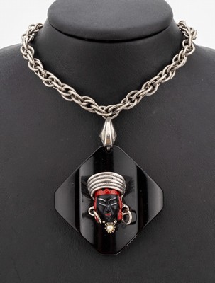 Image SELRO necklace, USA ca. 1960, middle part black bakelite, applied head with black and red ...