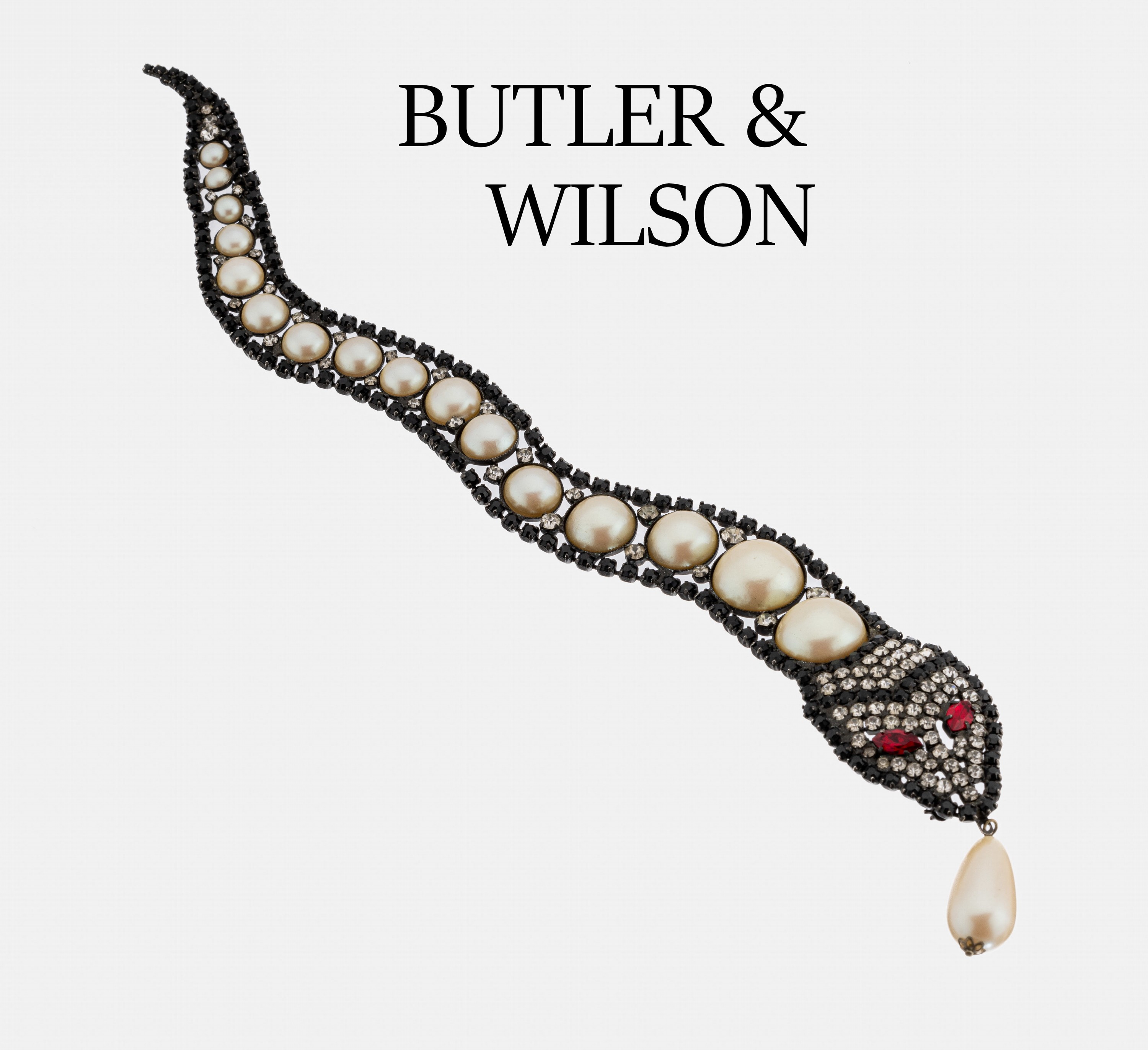 BUTLER & WILSON Schlangenbrosche, USA um 1980, Metall geschwärzt, außergewöhnliche Gestaltung, in sich bewegl., reicher Strassbesatz und ...