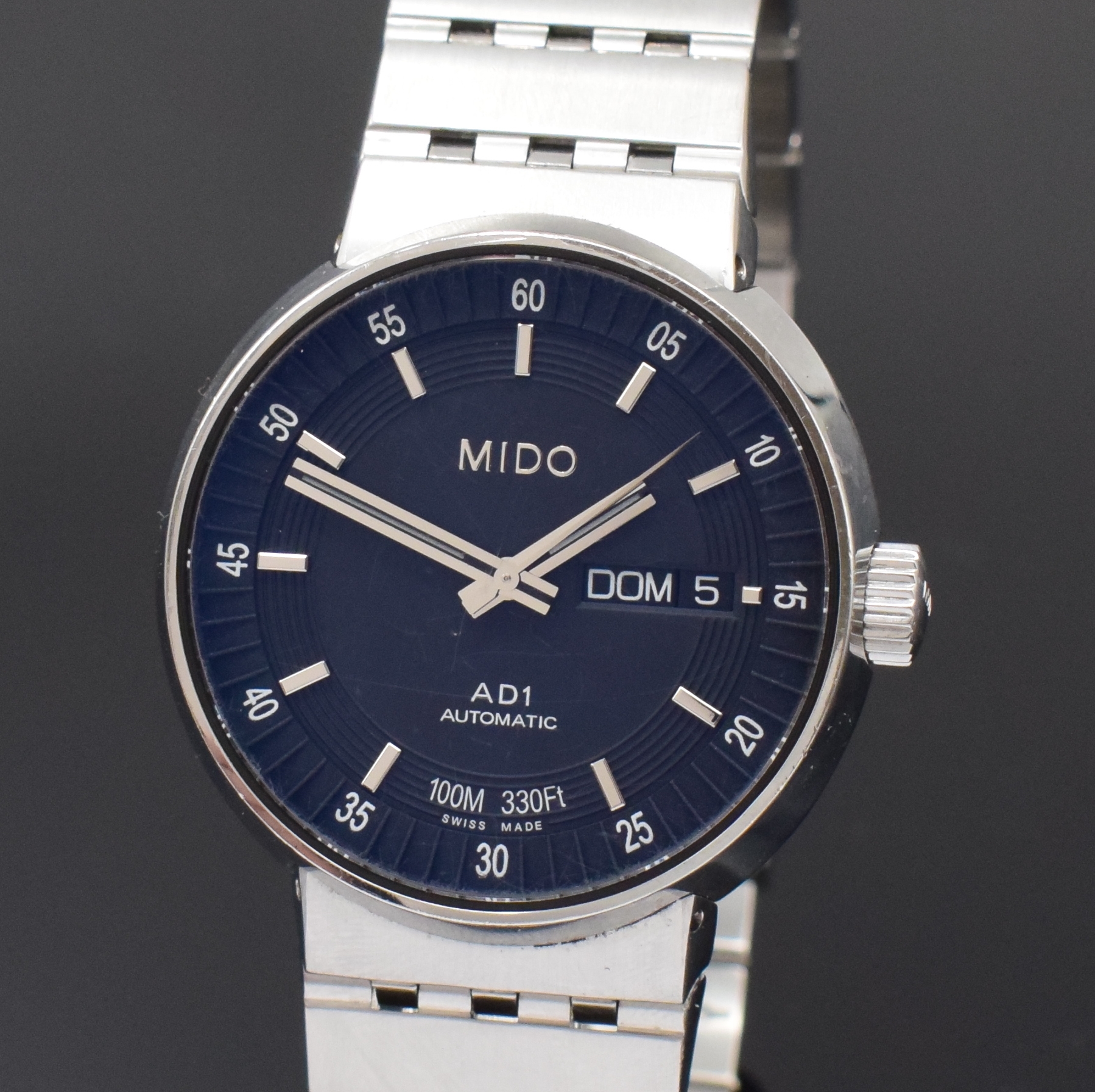 Detail a: MIDO AD1 Herrenarmbanduhr in Stahl Referenz M8330, Schweiz um 2010, Automatik, beids. verg. Geh. inkl. orig. Gliederband m. Faltschl., Boden u. Krone ...