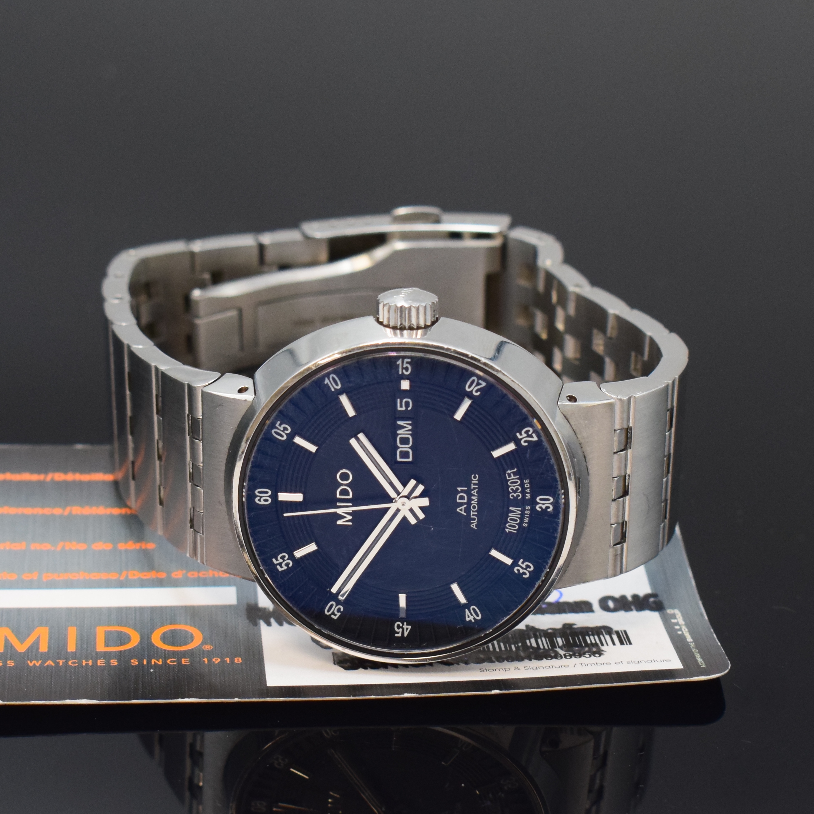 Detail e: MIDO AD1 Herrenarmbanduhr in Stahl Referenz M8330, Schweiz um 2010, Automatik, beids. verg. Geh. inkl. orig. Gliederband m. Faltschl., Boden u. Krone ...