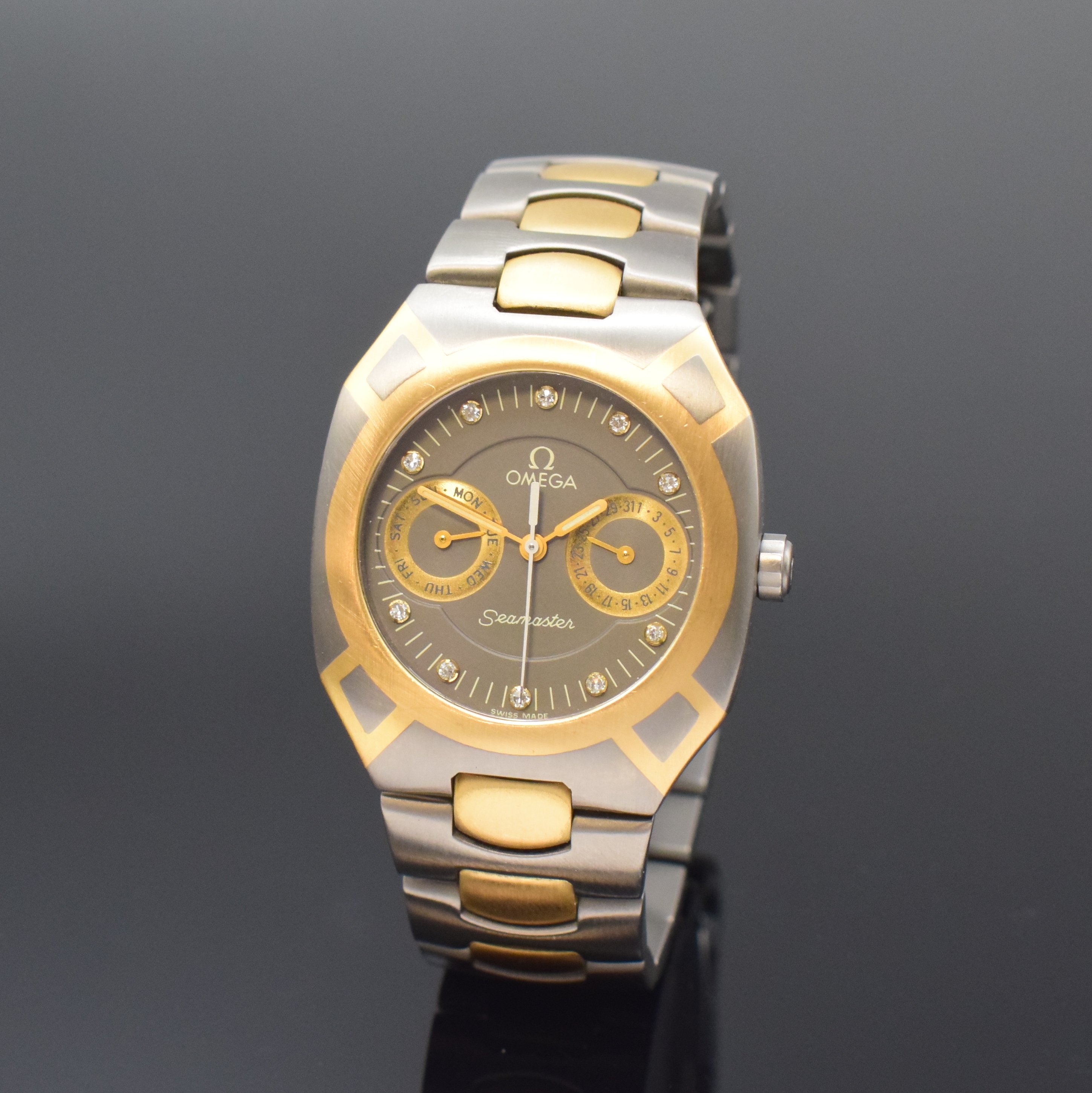 OMEGA Seamaster Polaris Armbanduhr in Titan/Gold, Schweiz um 1990, quarz, intarsierte Lünette sowie Zwischenglieder in GG, Faltschl., graues ...