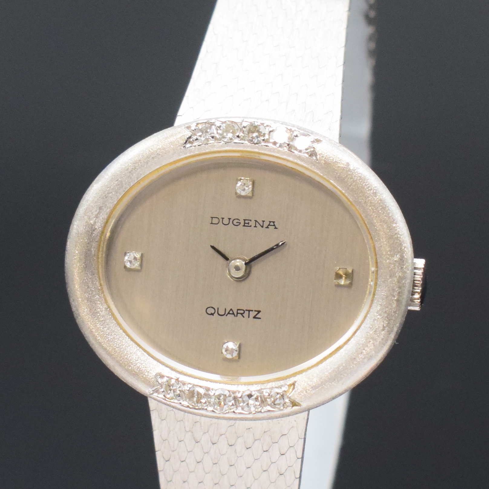 Detail a: DUGENA Damenarmbanduhr in WG 585/000 mit Diamanten, Schweiz um 1980, quarz, Boden aufgedr., Lünette teils mit Diamanten bes., silb. Zifferbl. m. ...