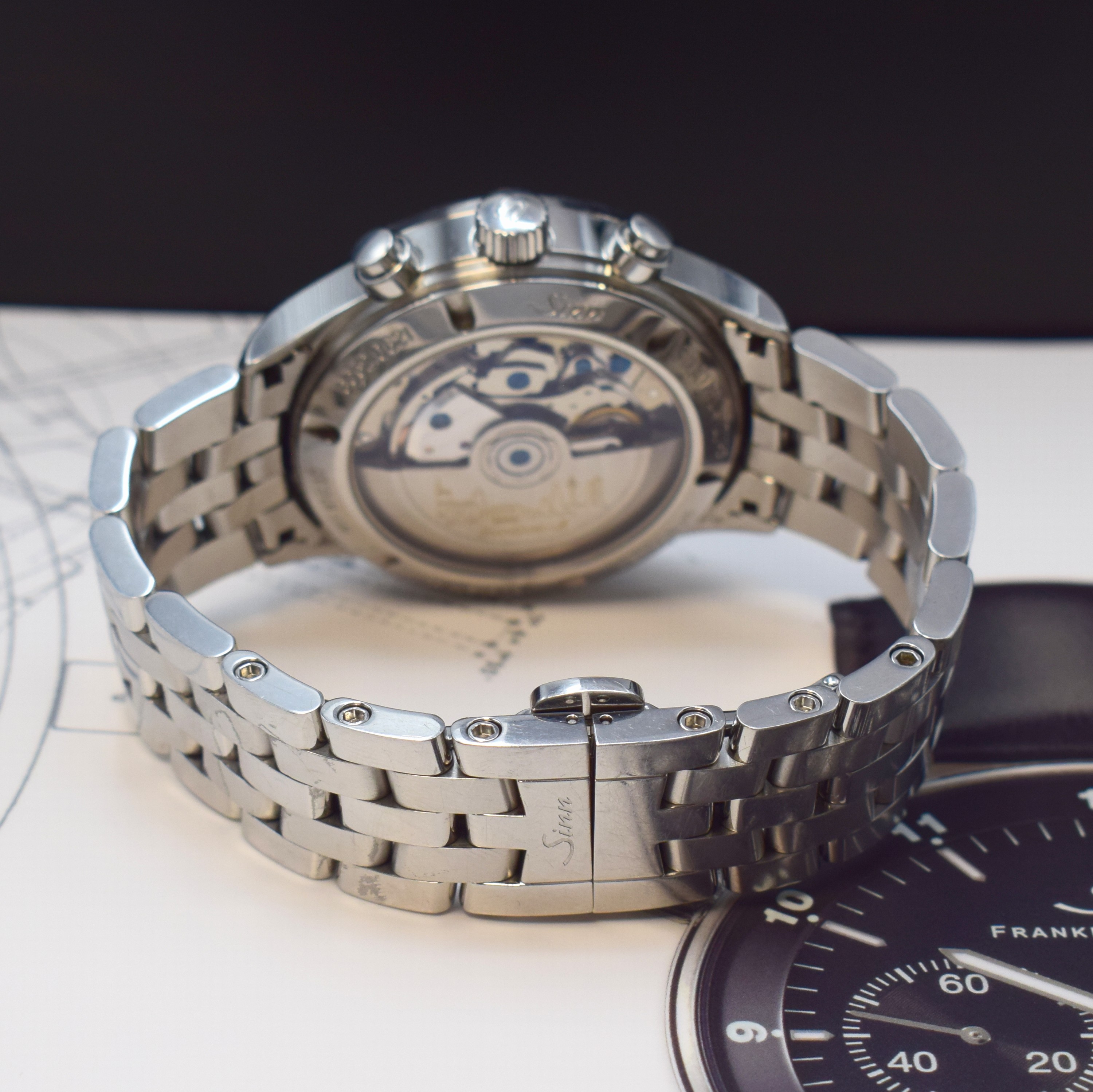 Detail b: SINN Finanzplatzuhr mit Chronograph Referenz 6052, Automatik, beids. vergl. Edelstahlgeh. inkl. Gliederband m. dopp. Faltschl., Boden verschr., ...