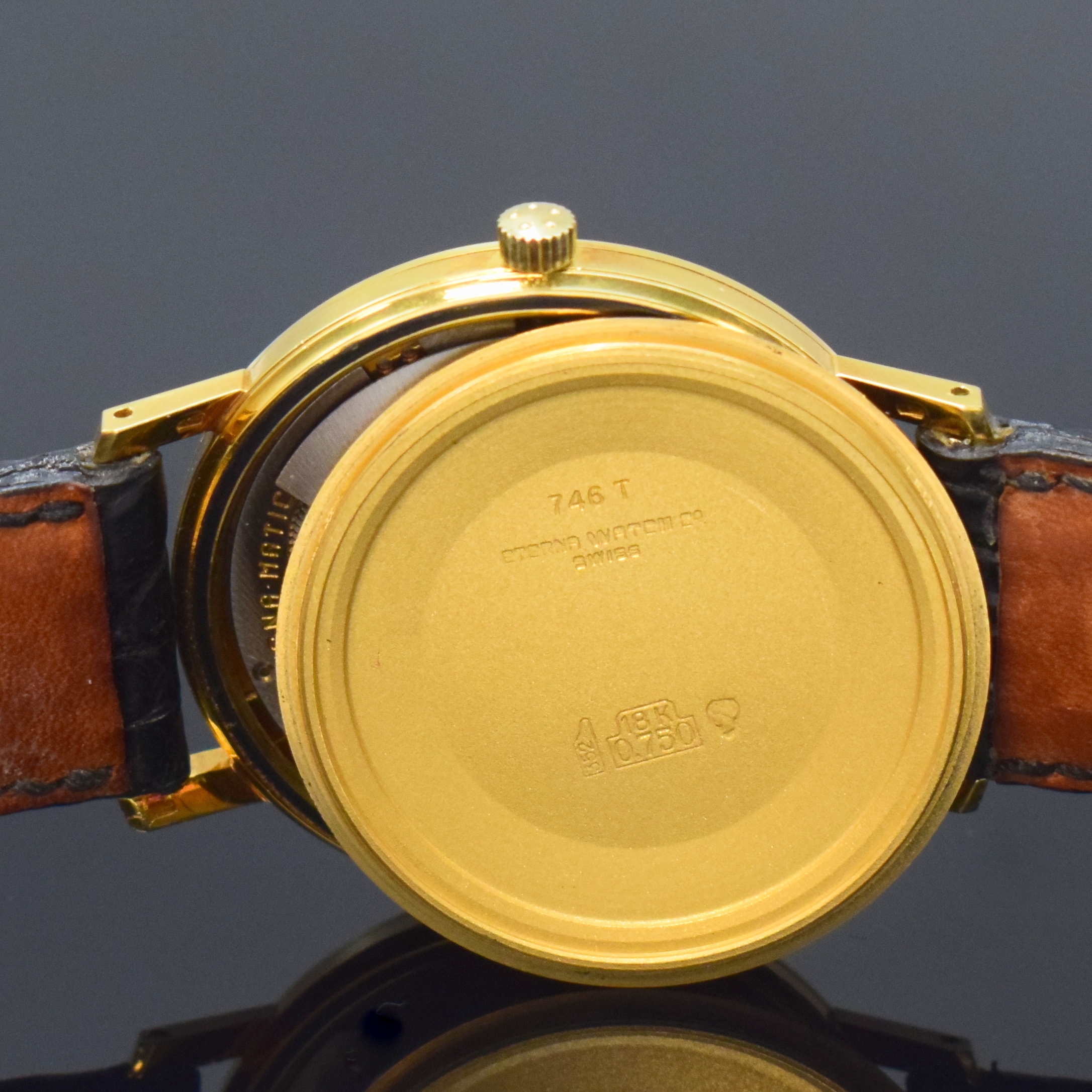 Detail g: ETERNA-MATIC 3000 Herrenarmbanduhr in GG 750/000 Referenz 746T, Schweiz um 1965, Automatik, Boden verschr., neutr. Lederband mit orig. verg. ...
