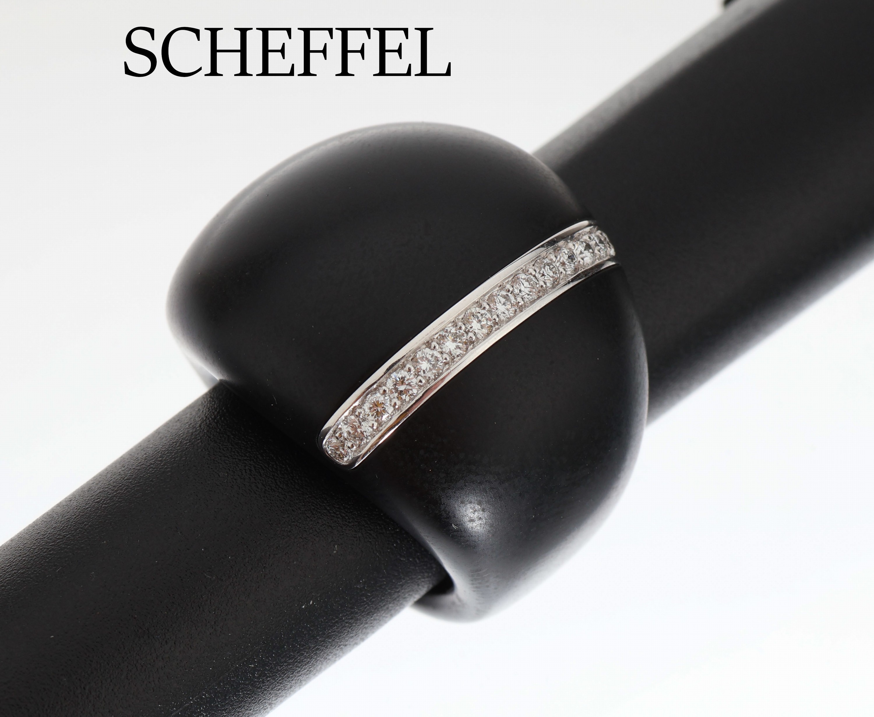 SCHEFFEL Brillant-Ring, aus der Serie Juma,Ringschiene schwarzes Holz, 15 in WG 750/000 gefasste Brillanten zus. ca. 0.32 ct feines Weiß/vs, RW 56, ...