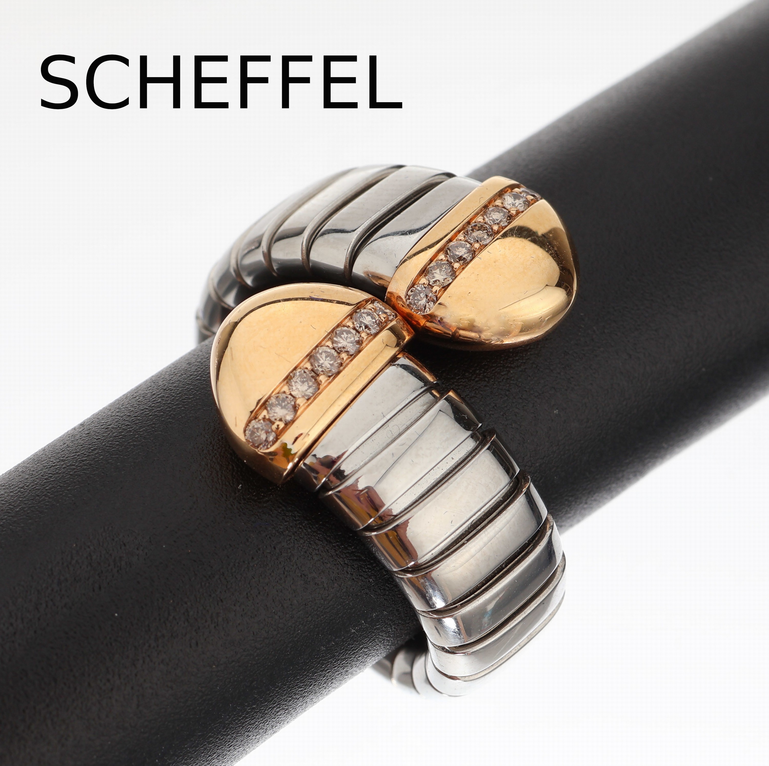 18 kt Gold und Stahl SCHEFFEL Brillant-Ring, GG 750/000, Ringschiene Stahl, 14 Brillanten zus. ca. 0.21 ct nat. brown/vs-si, RW 56