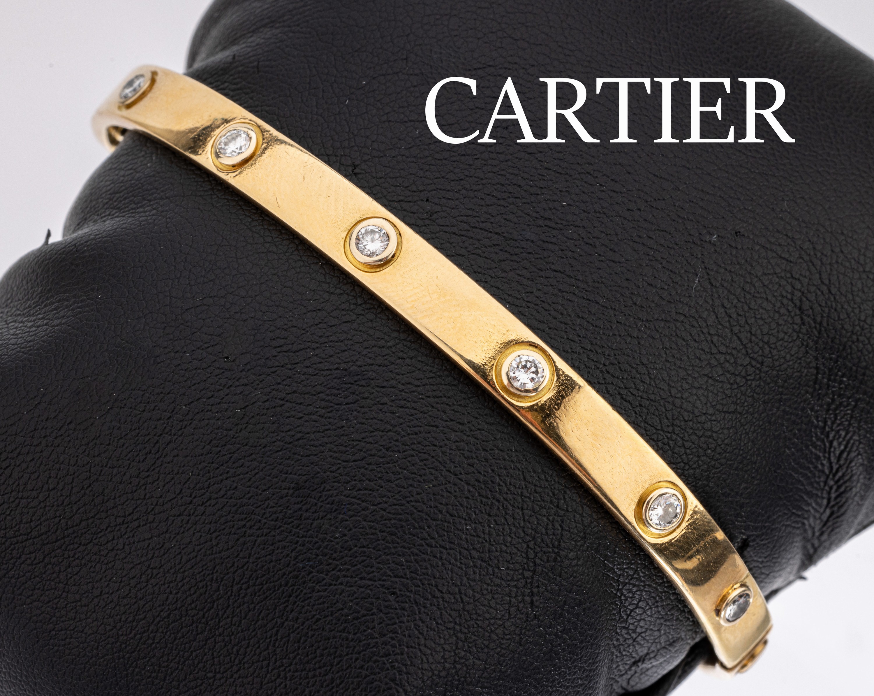 18 kt Gold CARTIER Brillant-Armreif "Love", GG 750/000, 12 Brillanten zus. ca. 1.20 ct Weiß/si, durch Weitenänderung Punze nur noch zu ...