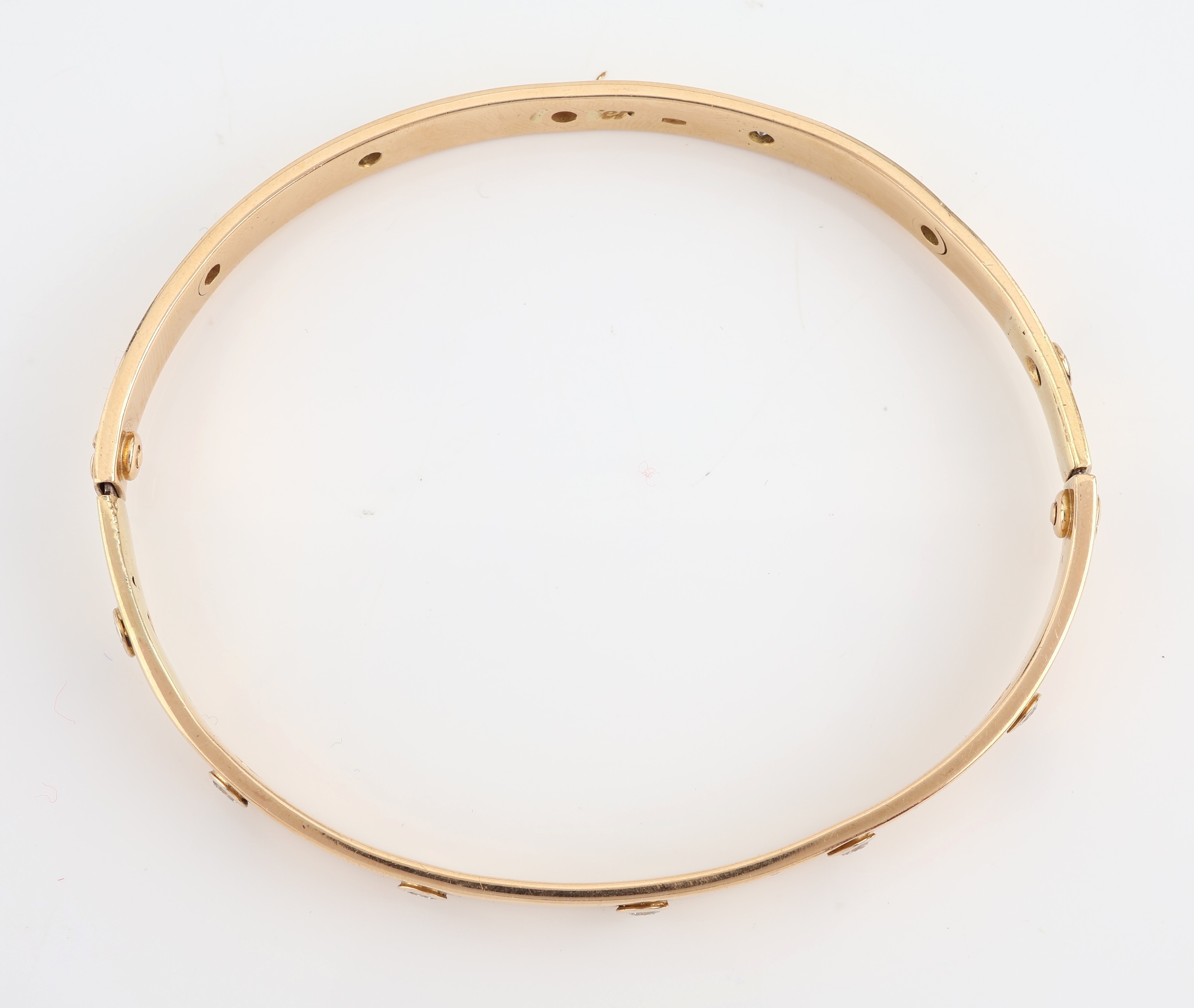 Detail b: 18 kt Gold CARTIER Brillant-Armreif "Love", GG 750/000, 12 Brillanten zus. ca. 1.20 ct Weiß/si, durch Weitenänderung Punze nur noch zu ...