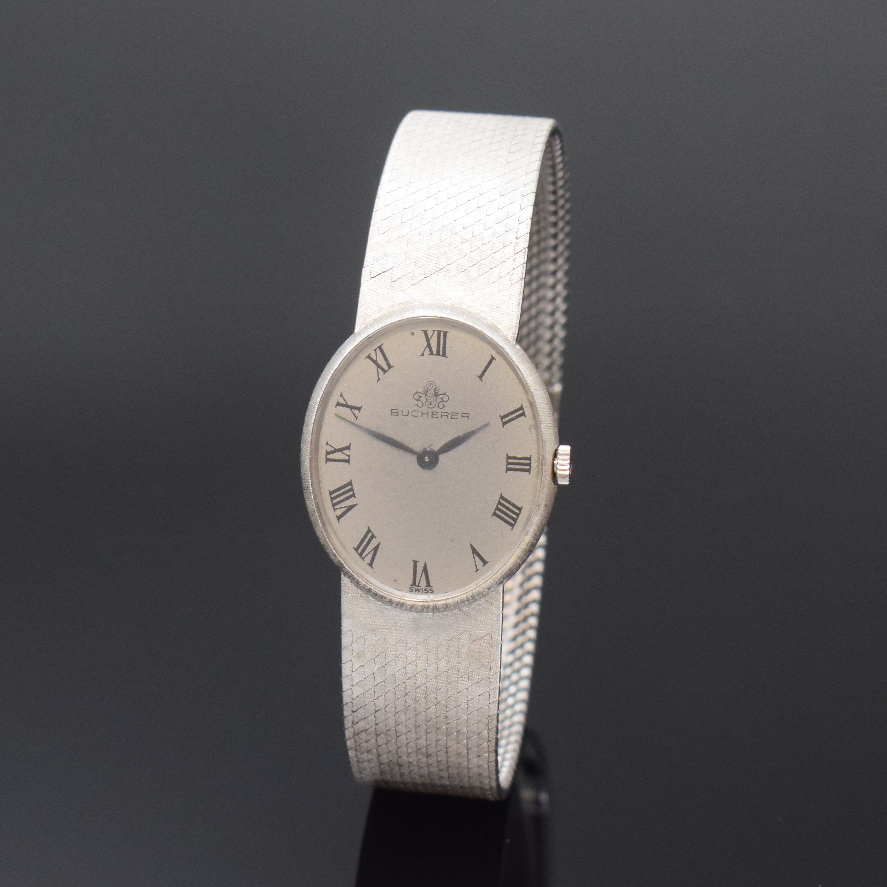 BUCHERER / CHOPARD Damenarmbanduhr in WG 750/000 Referenz 5029, Handaufzug, Schweiz um 1970, Boden aufgedr., silb. Strukturzifferbl. m. röm. Std., ...