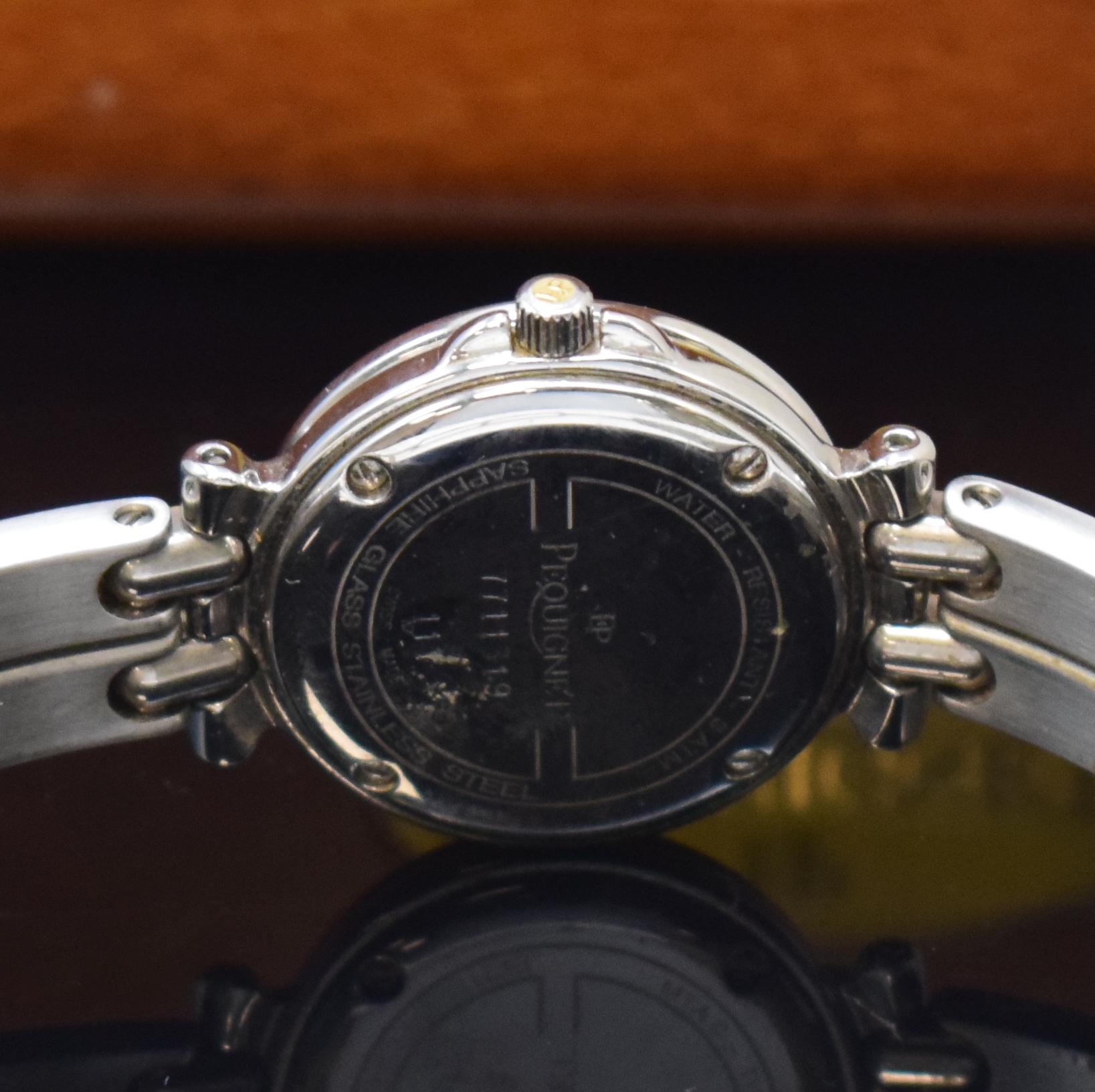 Detail d: PEQUINET Damenarmbanduhr in Stahl/Gold mit Diamanten, Schweiz verk. lt. beil. Garantie 03/1999, quarz, orig. Stahlband m. dopp. Faltschl., Boden ...