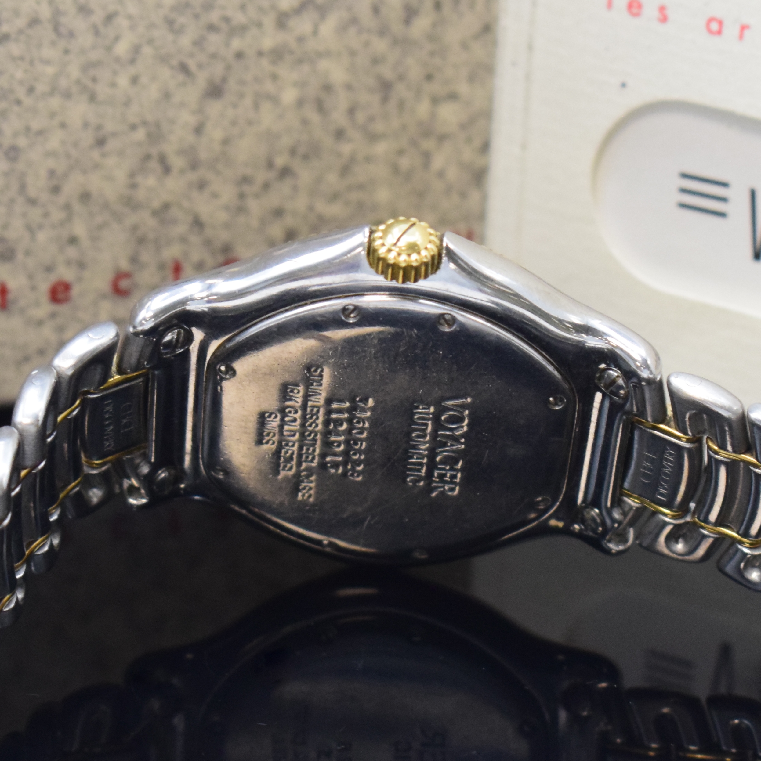 Detail d: EBEL Voyager Herrenarmbanduhr mit Weltzeitanzeige Referenz 1124913 in Stahl/Gold, Schweiz um 1990, Automatik, 8- fach verschr. Geh., beids. drehb. ...