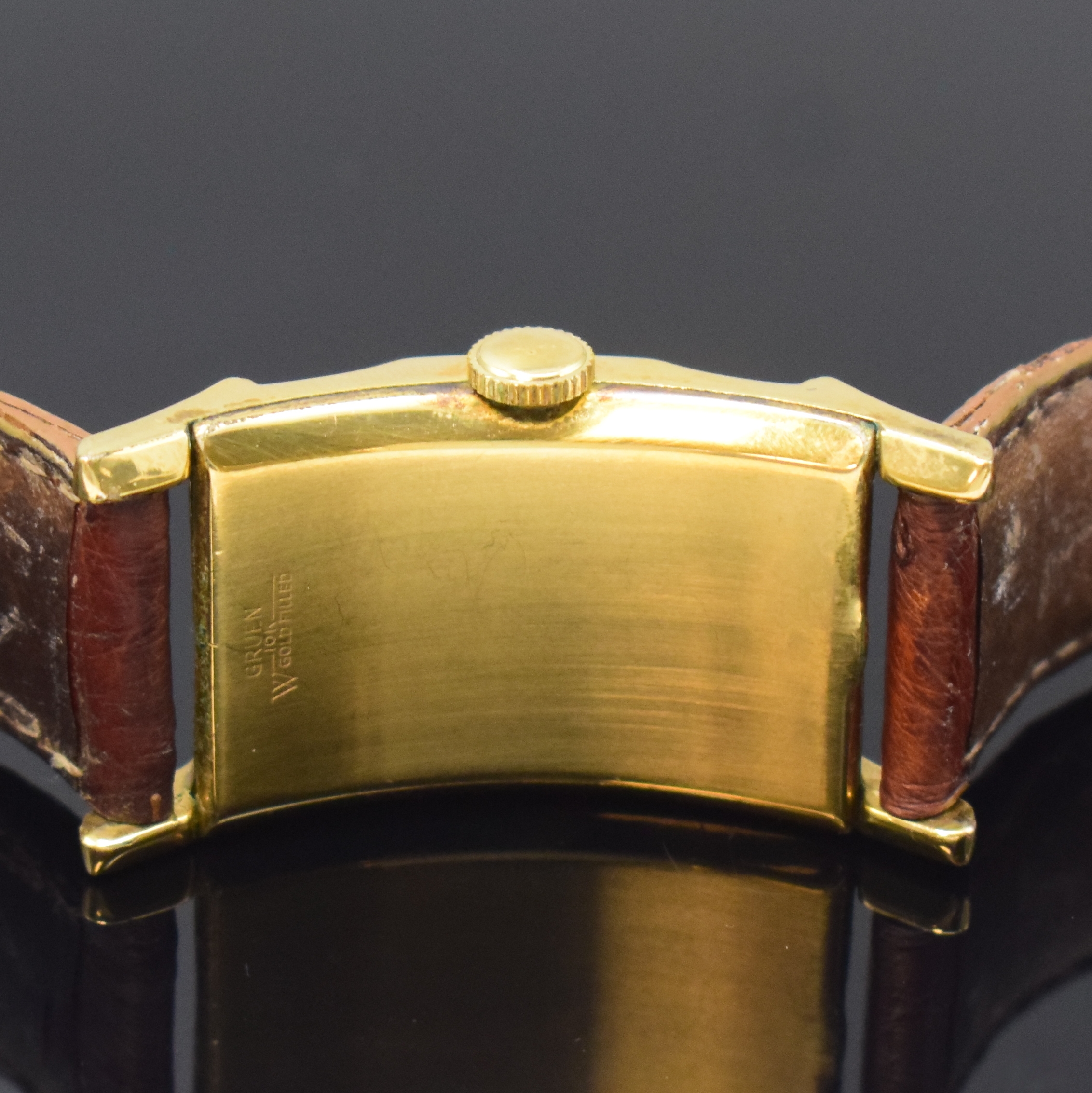 Detail c: GRUEN Curvex rechteckige Armbanduhr in 10k Gold-Filled, USA/Schweiz um 1945, Handaufzug, stark gebogenes Geh., Boden aufgedr., silb. Zifferbl. rest., ...