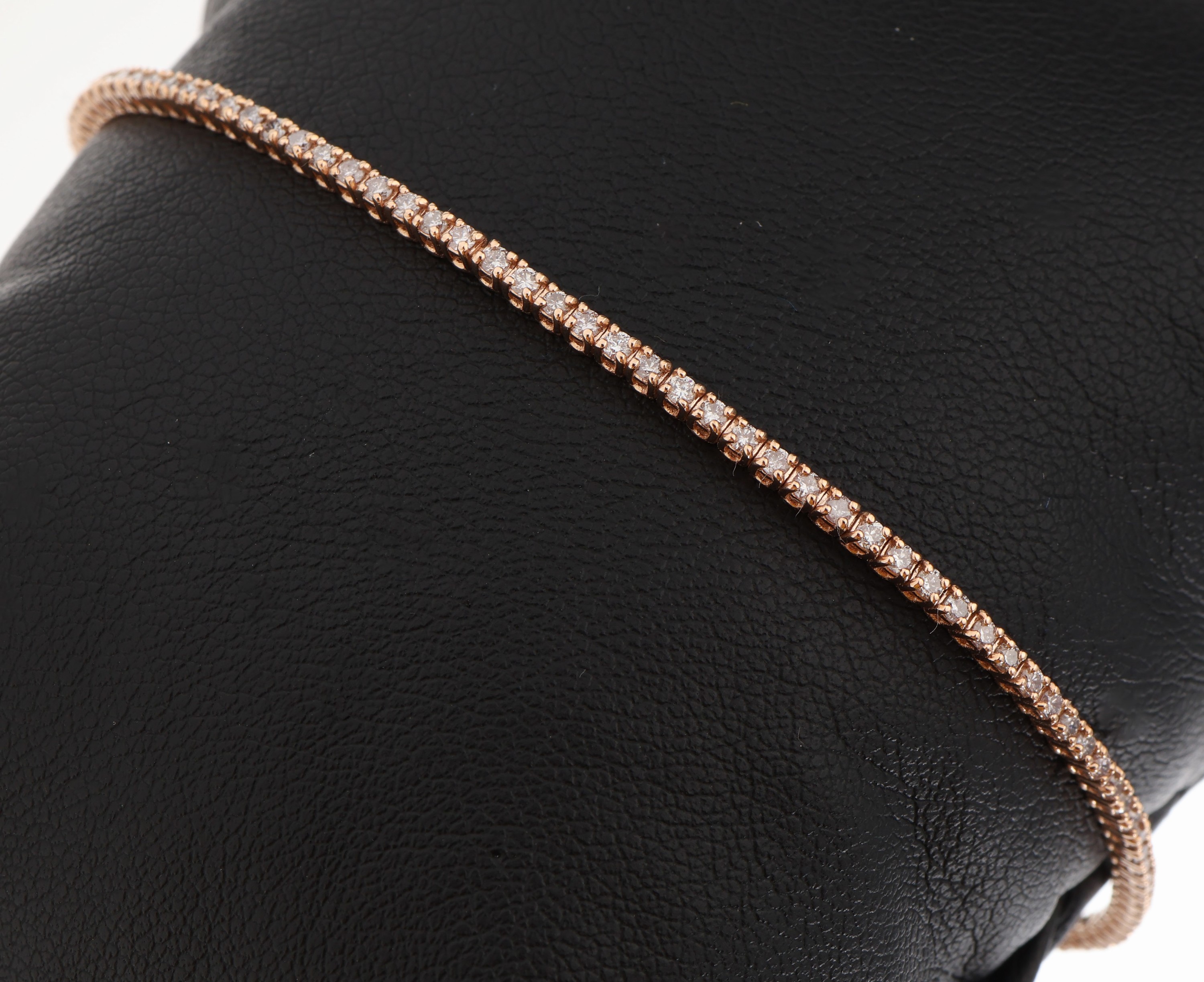 14 kt Gold Brillantarmband, RoseG 585/000, bes. mit 98 Brillanten zus. ca. 1.30 ct light Pink-natural fancy Pink/vs1-si3, L. ca. 18 cm,Kastenschlo? ...