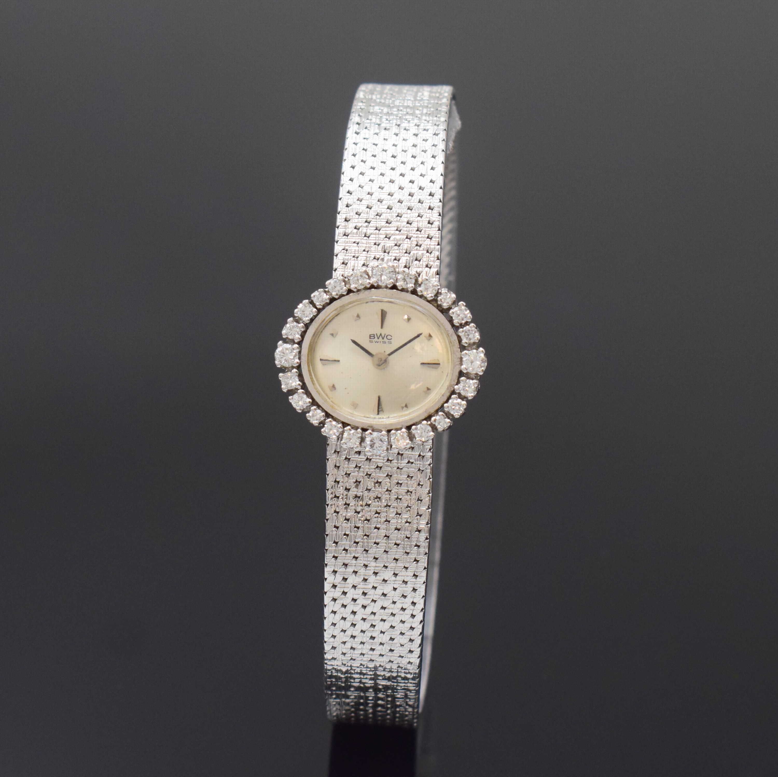 BWC Damenarmbanduhr in WG 750/000 mit Diamanten, Schweiz um 1965, Handaufzug, Boden aufgedr., Lünette aufw. m. Diamanten bes., vers. Zifferbl. m. ...