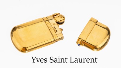 Image Yves Saint Laurent lighter , metal gilt, cover removable with small sapphire cabochon, ...