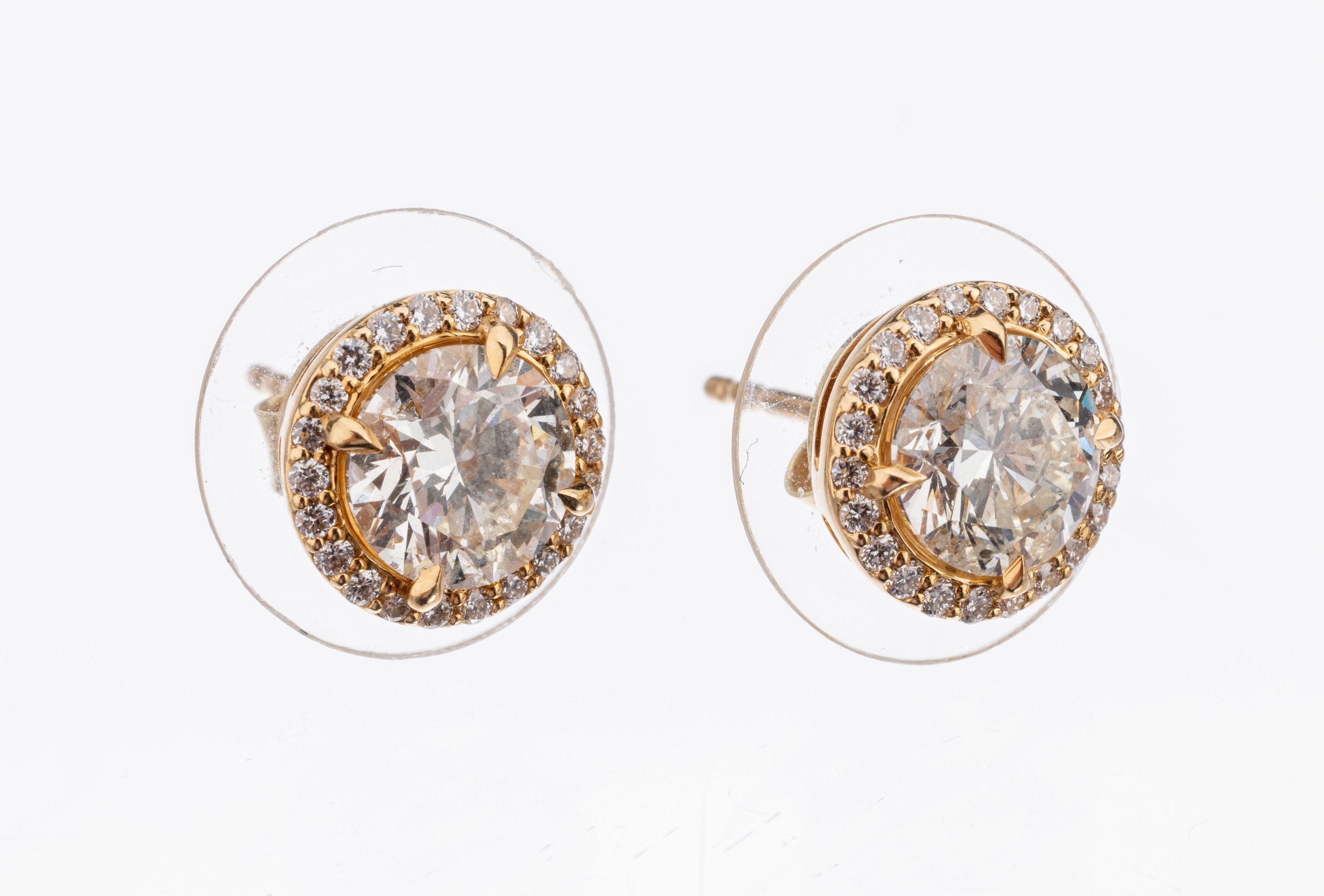 Paar 18 kt Gold Brillant-Ohrstecker, GG 750/000, 2 Brillanten zus. ca. 1.90 ct Weiss/vs, umgeben von weiteren 44 Brillanten zus. ca. 0.20 ct ...