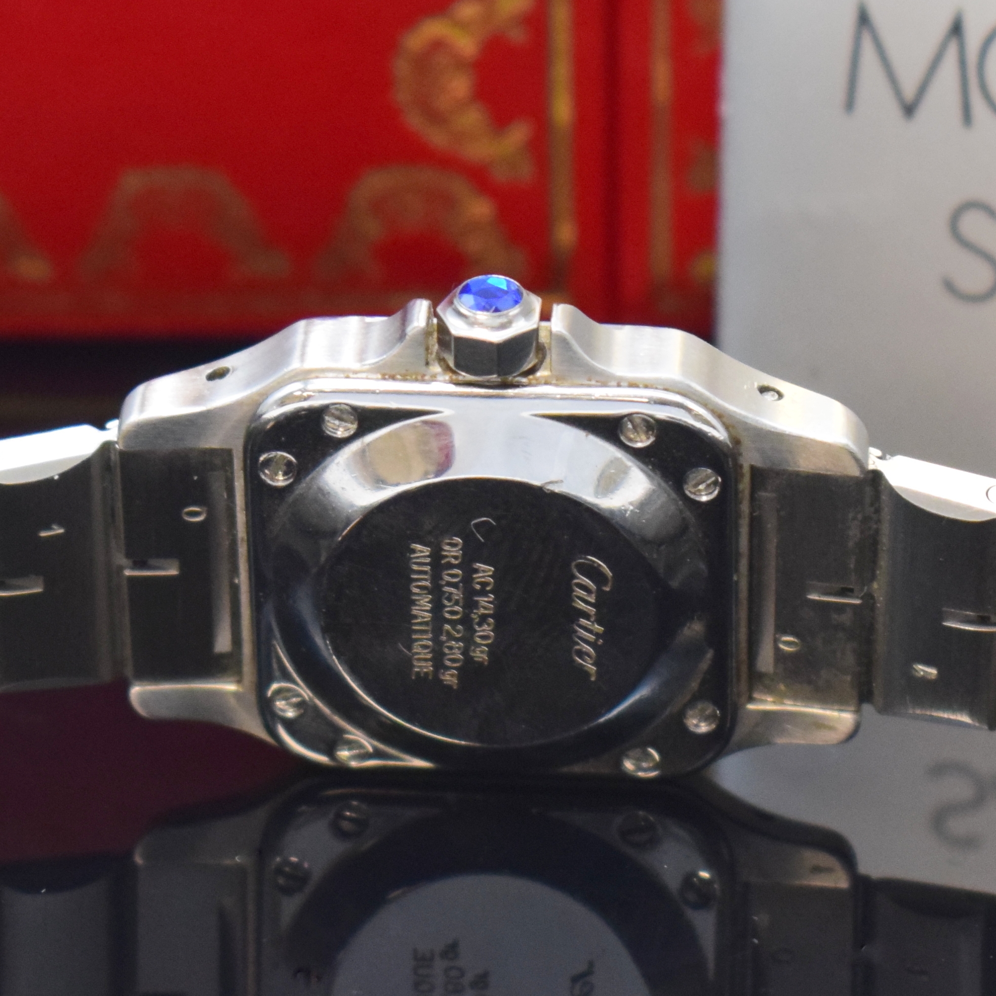 Detail d: CARTIER Santos Damenarmbanduhr in Stahl/Gold, Schweiz um 1990, Automatik, orig. Gliederband m. Faltschl., Boden 8-fach verschr., Schmuckkrone, ...