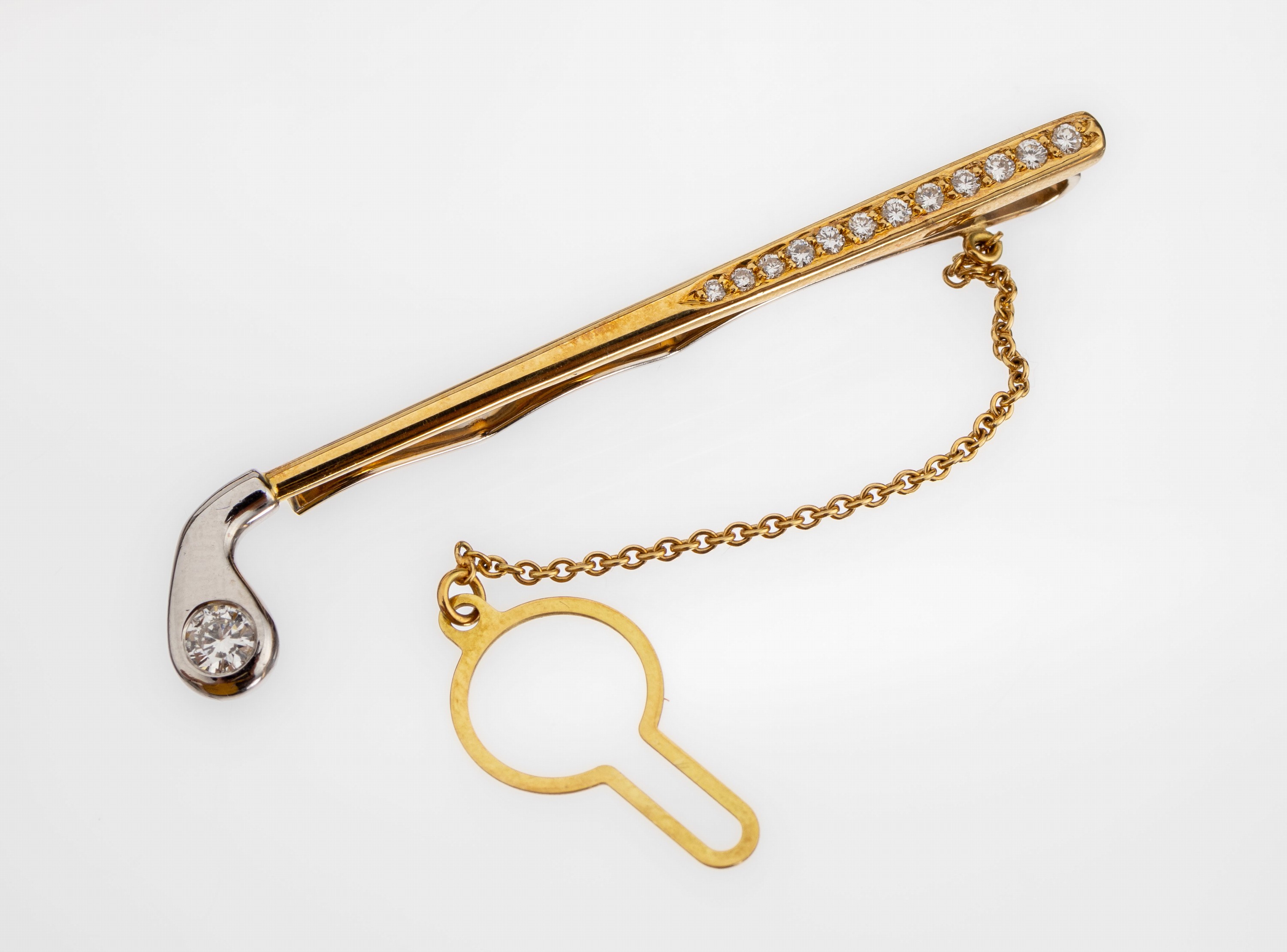 14 kt Gold Brillant-Krawattenclip "Golfschläger", GG/WG 585/000 gepr., Kopf in WG mit einzelnem Brillant ca. 0.25 ct Weiß/si, Griff mit ...