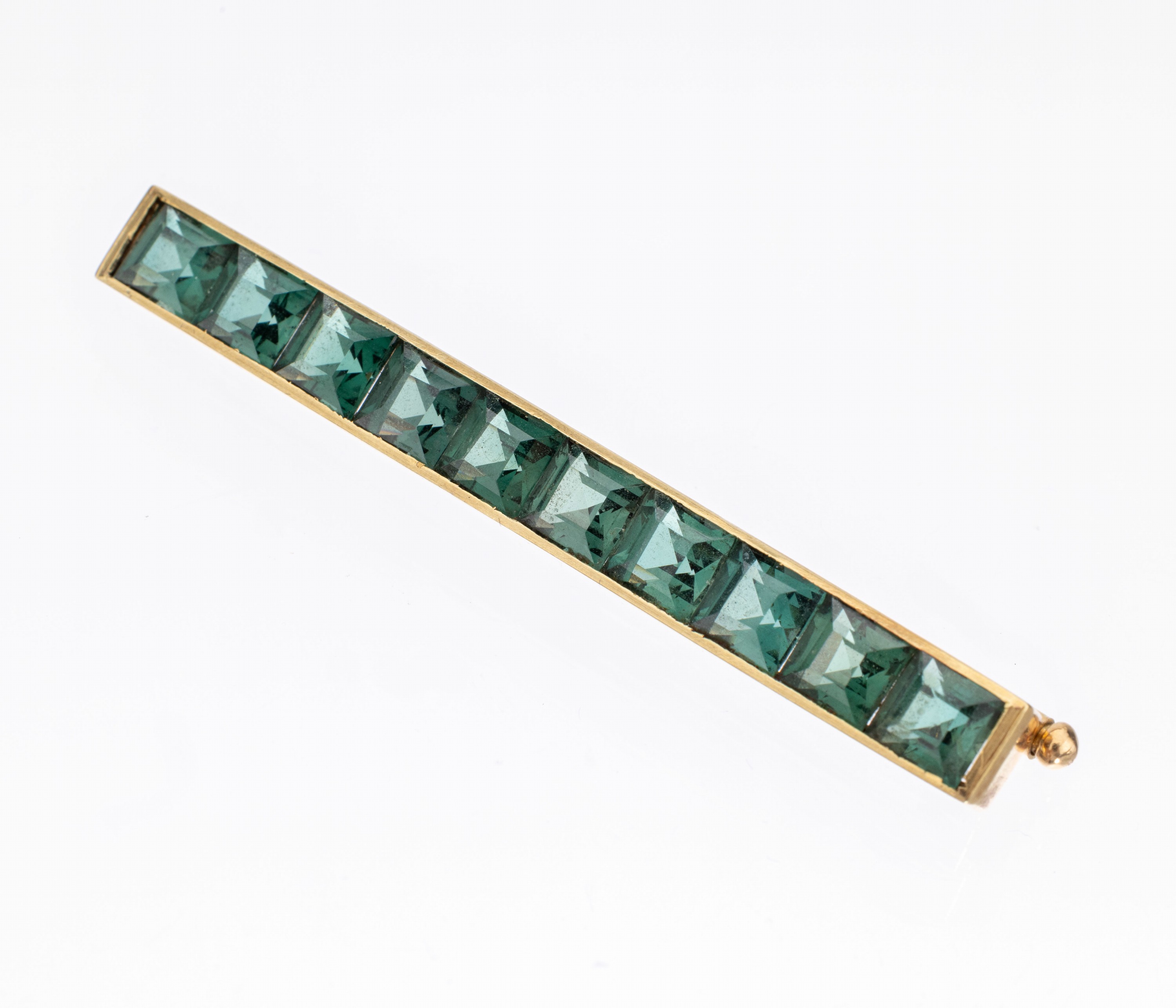 14 kt Gold Turmalin-Brosche, GG 585/000, länglich, 10 Turmalin-Carrees zus. ca. 7.50 ct, L. ca. 6 cm, ca. 8.4 g
