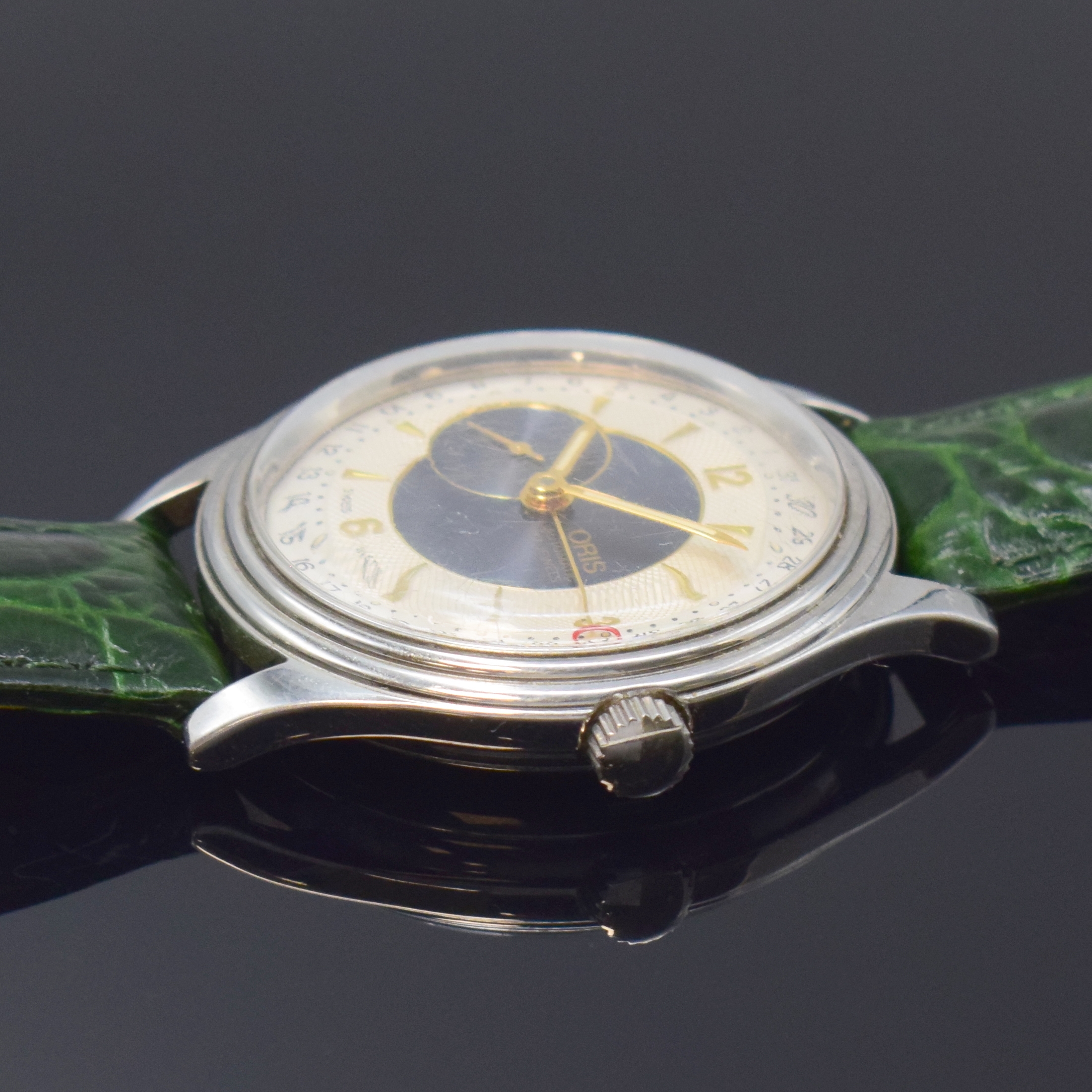 Detail b: ORIS Herrenarmbanduhr in Edelstahl mit Zeigerdatum Referenz 7461, Schweiz um 1995, Automatik, beids. vergl. Geh., Boden verschr., silb. teils guill. ...