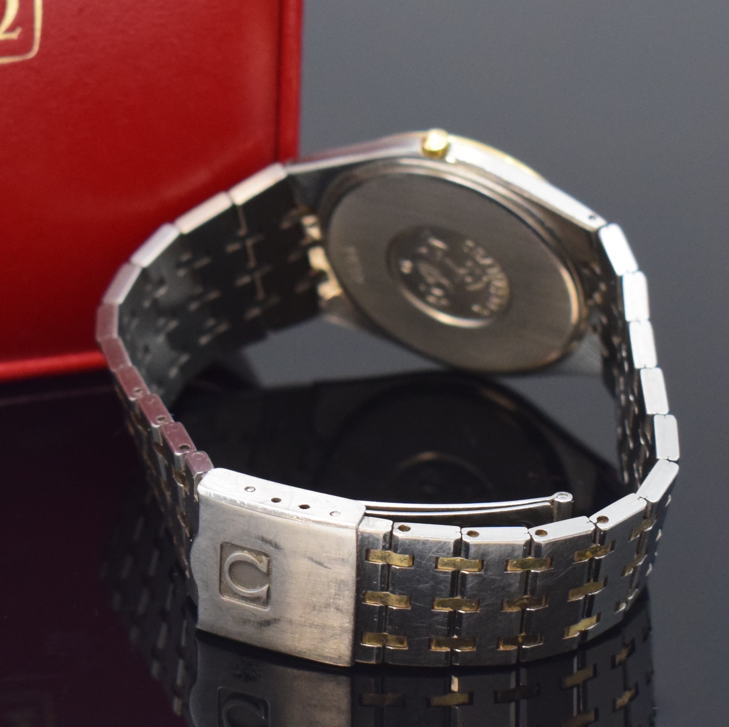 Detail b: OMEGA Seamaster Herrenarmbanduhr in Stahl/Gold Referenz 196.0275/396.0964, Schweiz um 1985, quarz, orig. Gliederband m. Faltschl., Boden aufgedr., ...