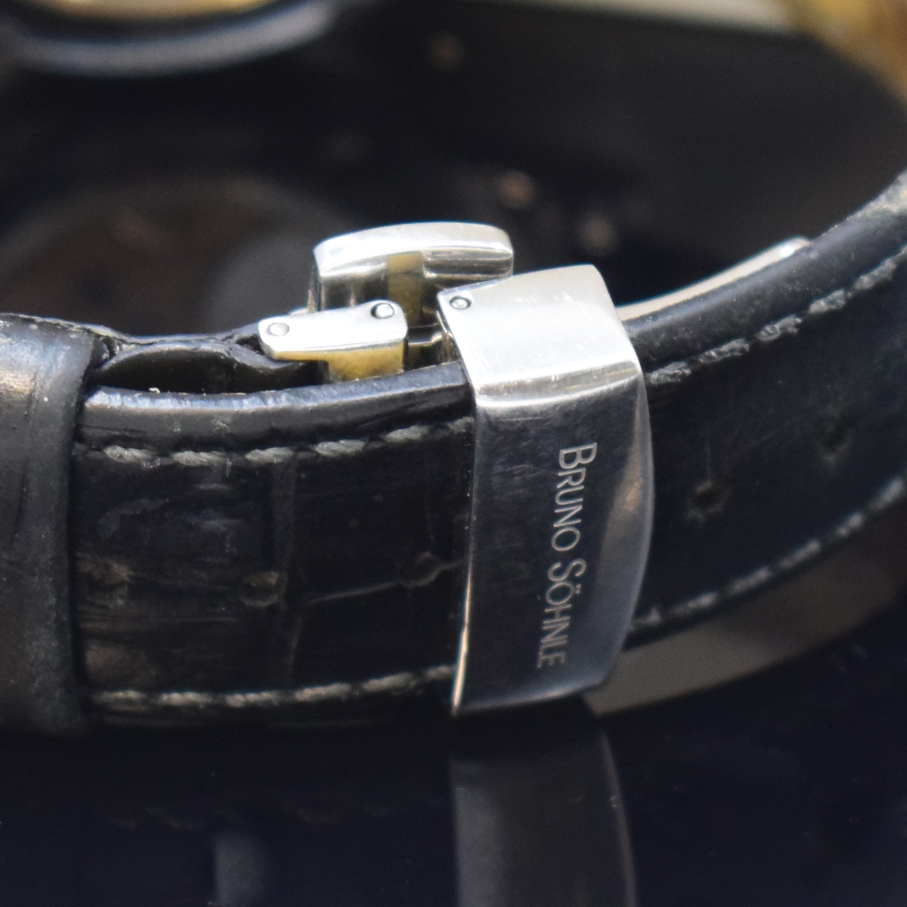 Detail b: BRUNO SÖHNLE Pesaro Herrenarmbanduhr in Stahl/Gold, Deutschland um 2008, quarz, beids. vergl. Geh., Saphirglas, Boden 6-fach verschr., Krone ...