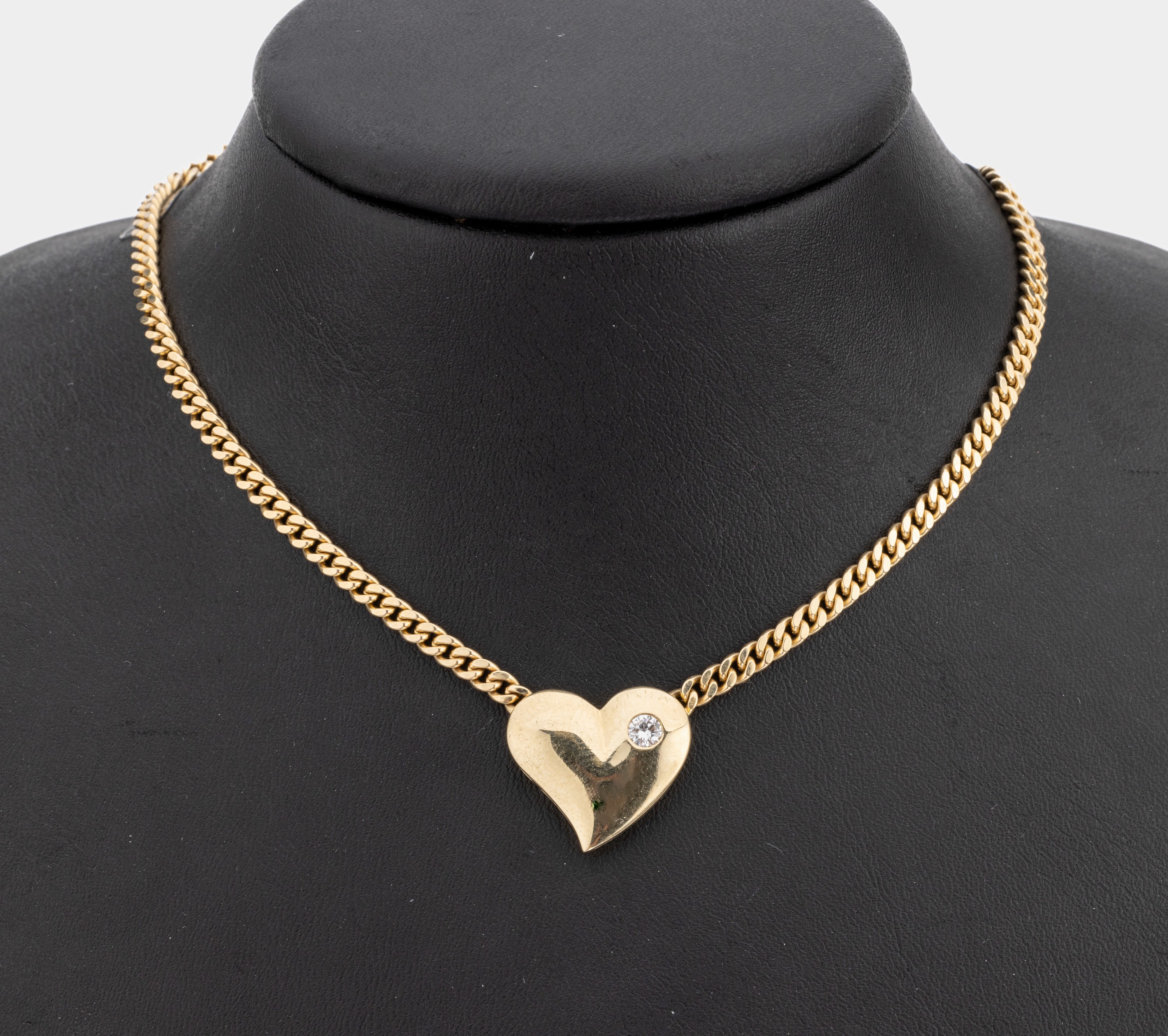 14 kt Gold Brillant Collier, "Herz", GG 585/000, Flachpanzer, Herz besetzt mit einem Brillant ca. 0.20 ct Weiss/si, L. ca. 42.5 cm, ...
