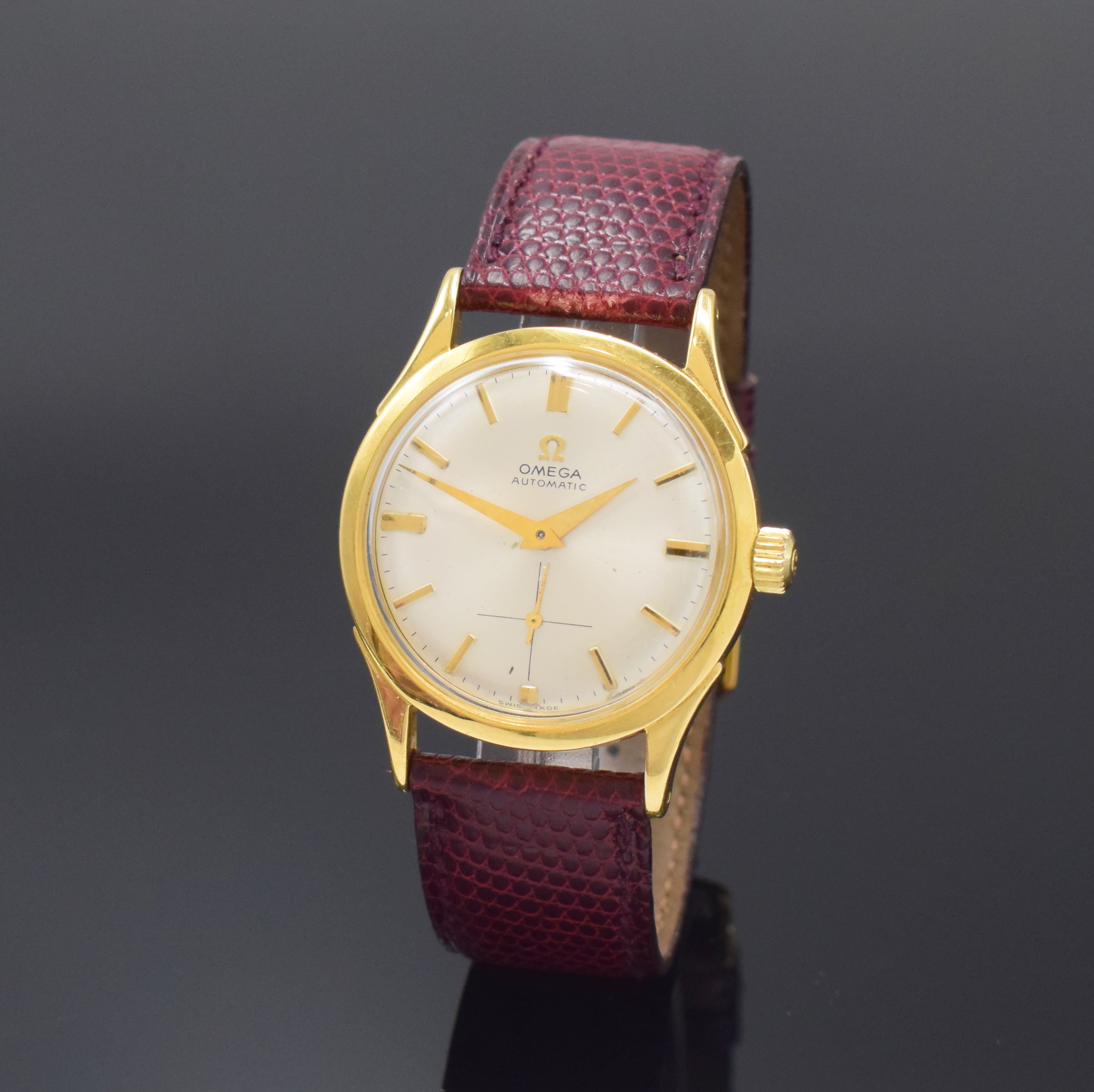 OMEGA Herrenarmbanduhr mit Hammerautomatik in GG 750/000 Referenz 2581, Schweiz um 1950, Automatik, dell. Boden verschr., silb. späteres orig. ...