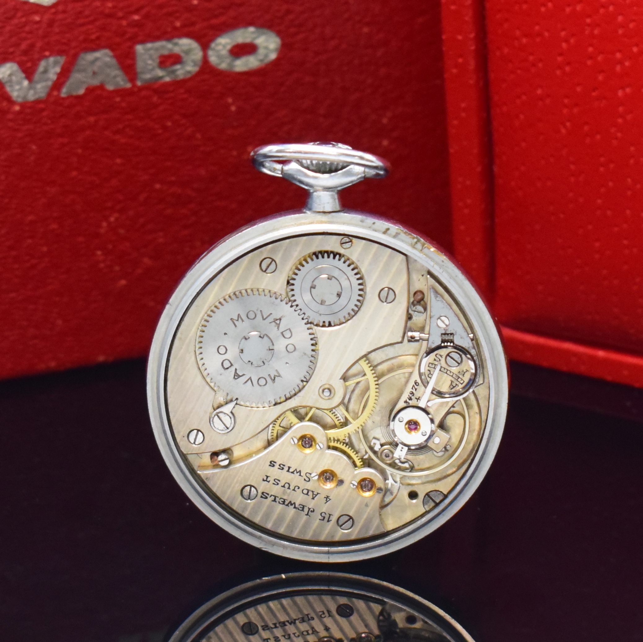 Detail b: MOVADO offene verchromte Taschenuhr mit Movado Box und Umkarton, Schweiz um 1925, Handaufzug, Boden aufgedr., Emailzifferbl. riss., arab. Zahlen, ...