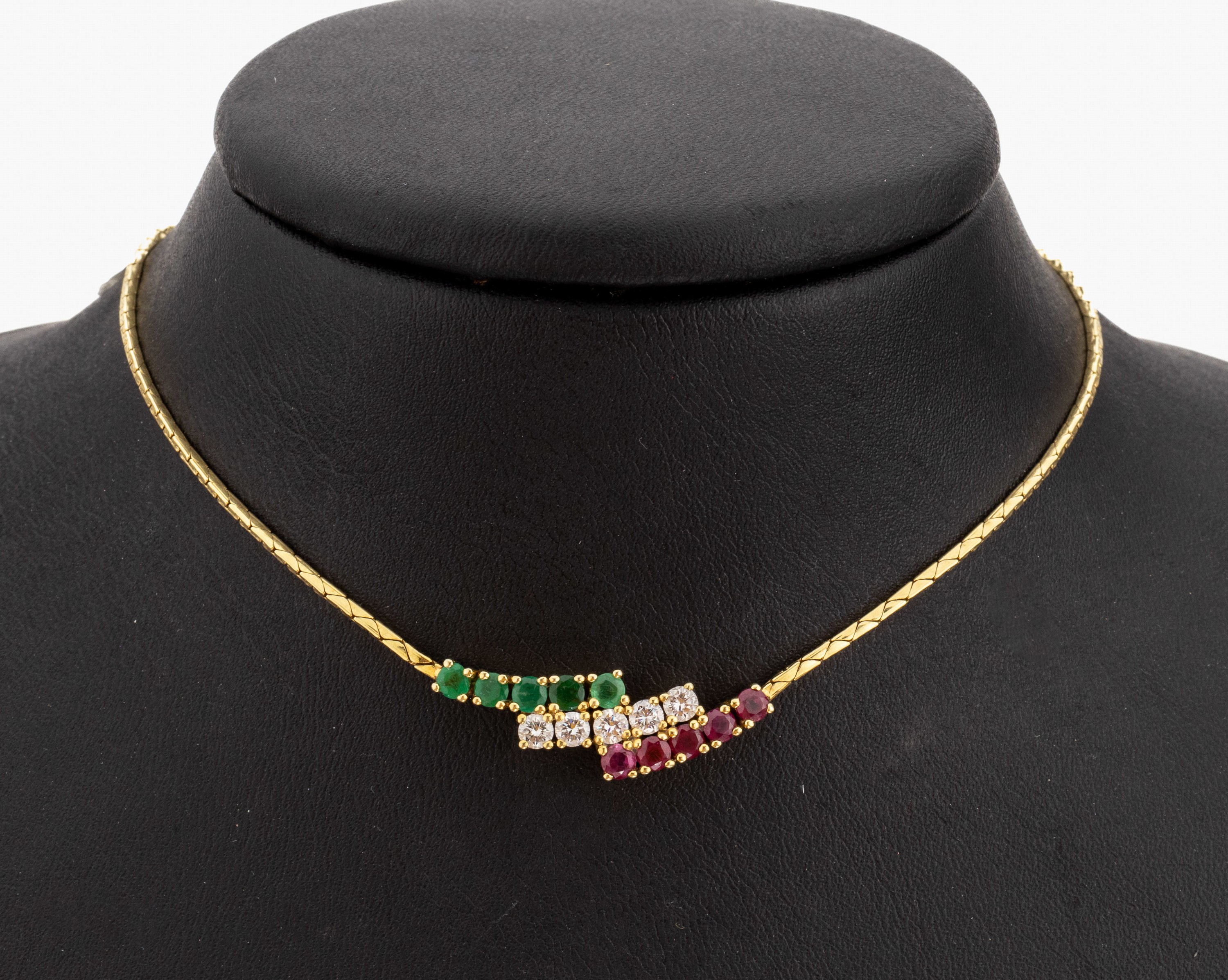 14 kt Gold Brillant-Smaragd-Rubin-Collier, GG 585/000, 5 Brillanten zus. ca. 0.50 ct Weiss/si, 5 rundfacett. Smaragde zus. ca. 0.50 ct, 5 ...