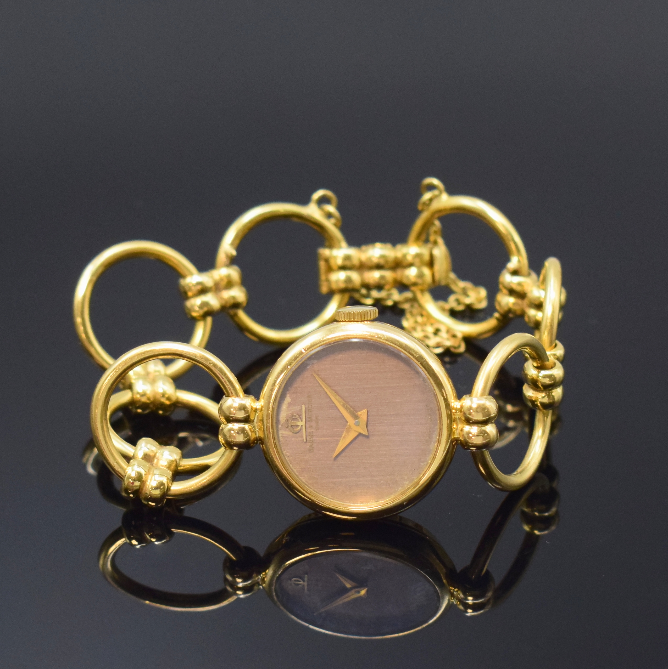 BAUME & MERCIER ausgefallene Damenarmbanduhr in GG 750/000, Schweiz um 1970, Handaufzug, 2-tlg. Geh., Boden aufgedr., Band aus 7 beweglichen ...