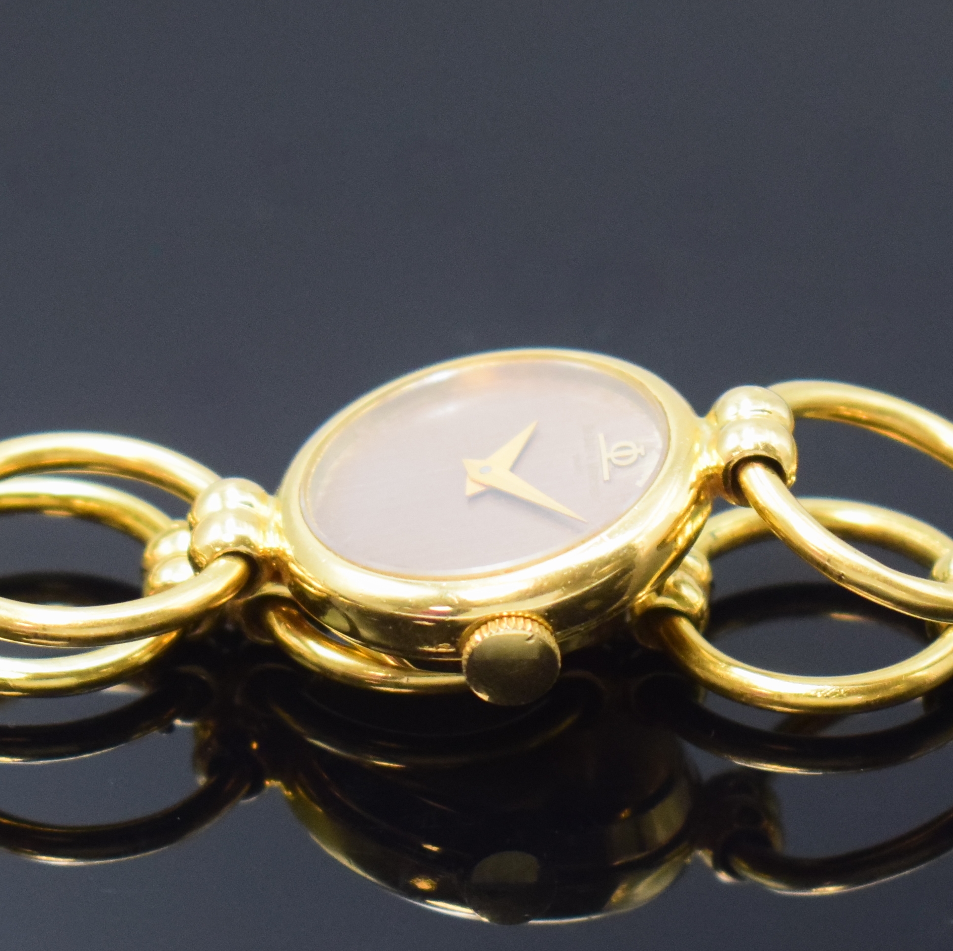 Detail b: BAUME & MERCIER ausgefallene Damenarmbanduhr in GG 750/000, Schweiz um 1970, Handaufzug, 2-tlg. Geh., Boden aufgedr., Band aus 7 beweglichen ...
