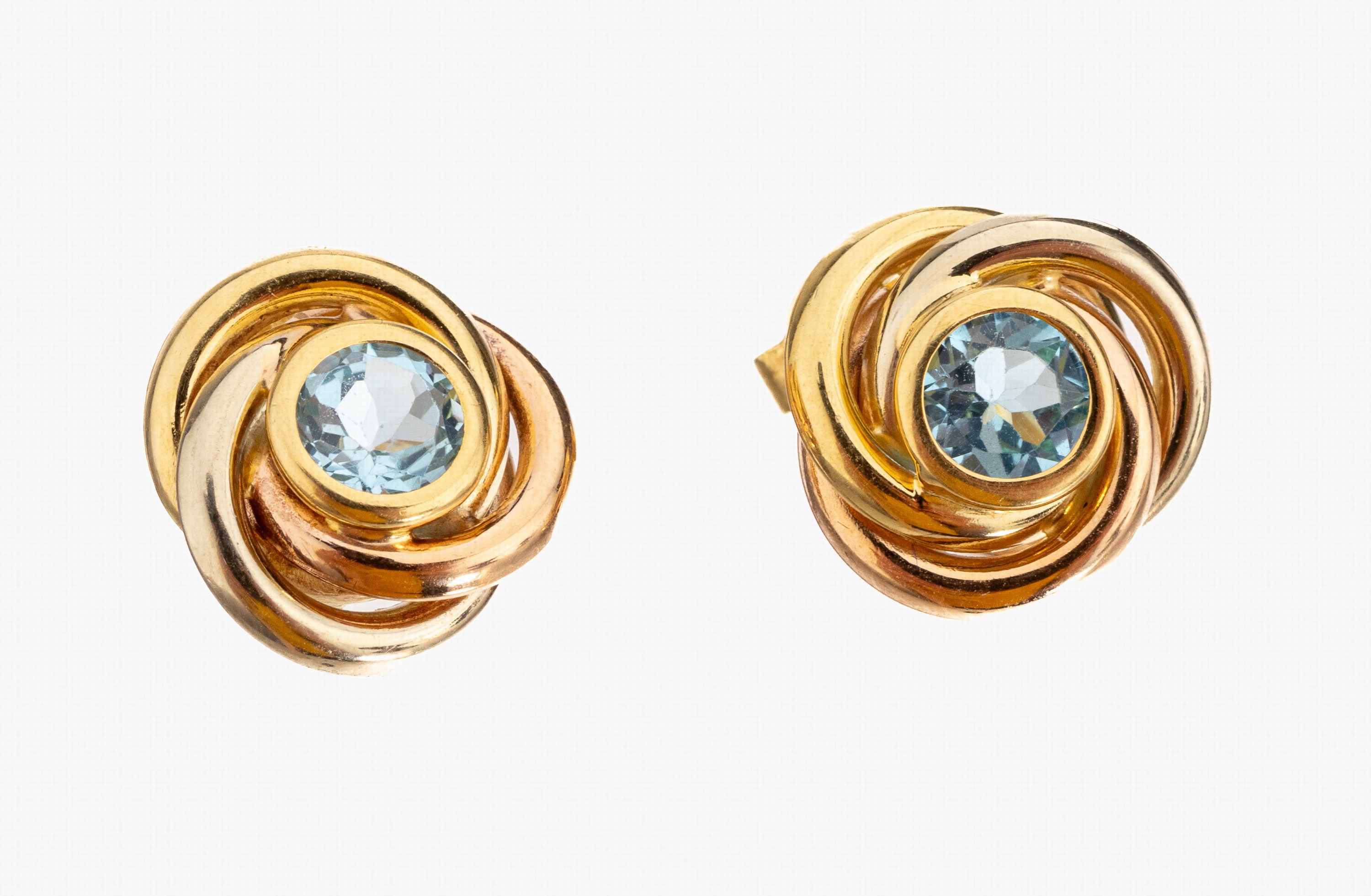 Paar 18 kt Gold Topas-Ohrstecker, GG 750/000, Knotenform, 2 rundfacett. Blautopase (beh.), ca. 3.6 g