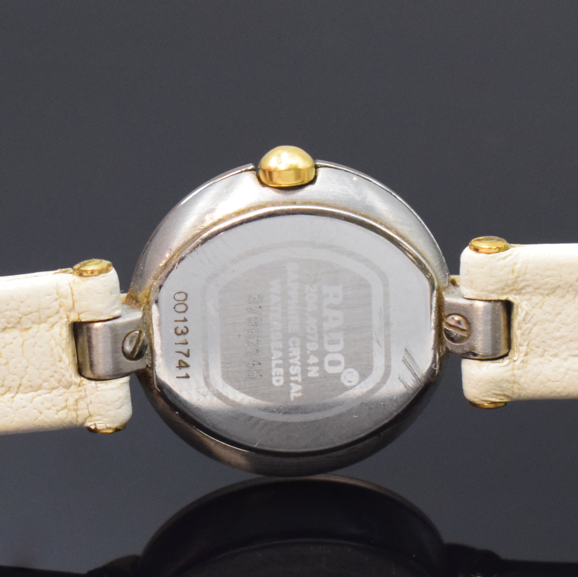 Detail d: RADO Damenarmbanduhr Referenz 204.4079.4N, Schweiz um 2010, quarz, verg. Geh. inkl. orig. Lederband m. verg. Dornschl., Boden aufgedr., ...