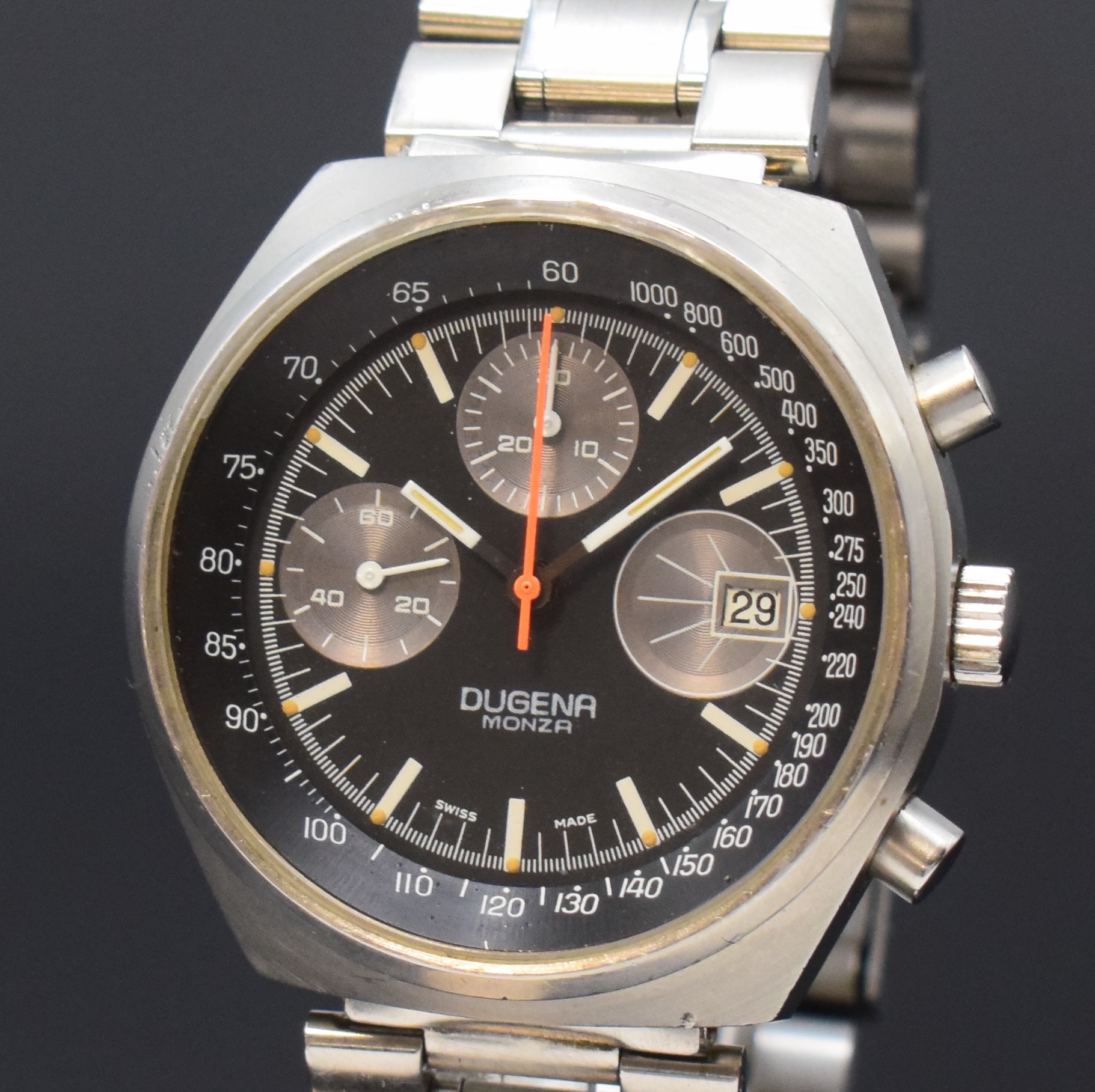 Detail a: DUGENA Monza Armbandchronograph in Stahl, Schweiz um 1970, Handaufzug, matt. Geh. inkl. neutr. Gliederband m. Faltschl., verschr. Boden m. Gravur ...