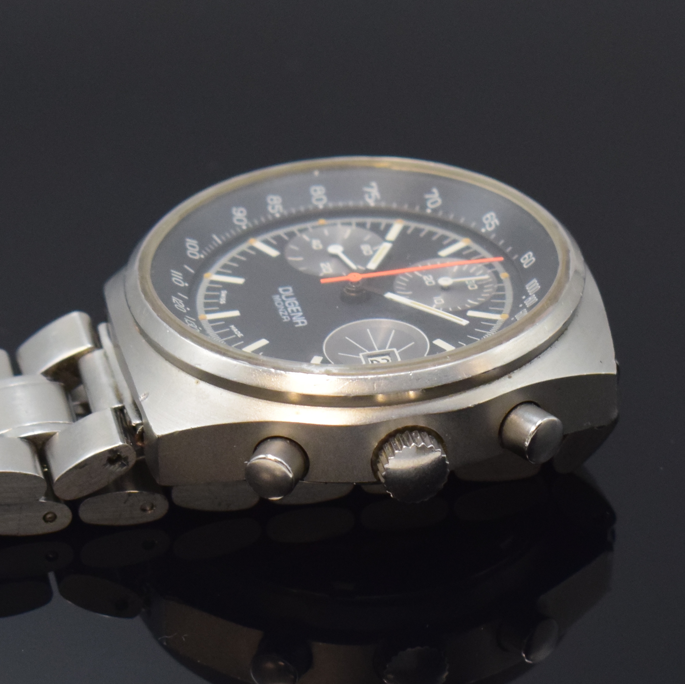 Detail c: DUGENA Monza Armbandchronograph in Stahl, Schweiz um 1970, Handaufzug, matt. Geh. inkl. neutr. Gliederband m. Faltschl., verschr. Boden m. Gravur ...