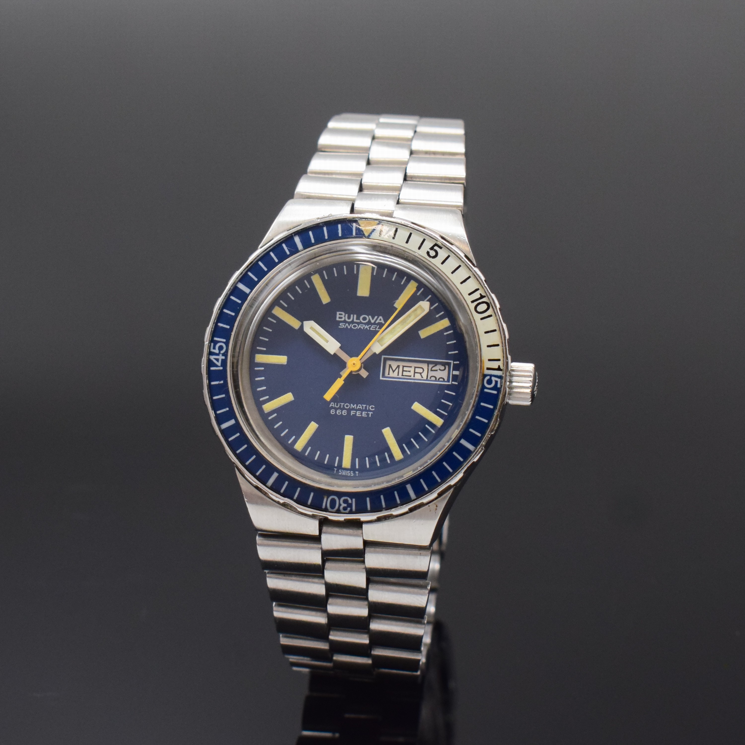 BULOVA Snorkel Herrenarmbanduhr in stahl, Schweiz um 1970, Automatik, orig. Gliederband m. Faltschl., Boden verschr., Lünette m. 60er Teilung beids. ...