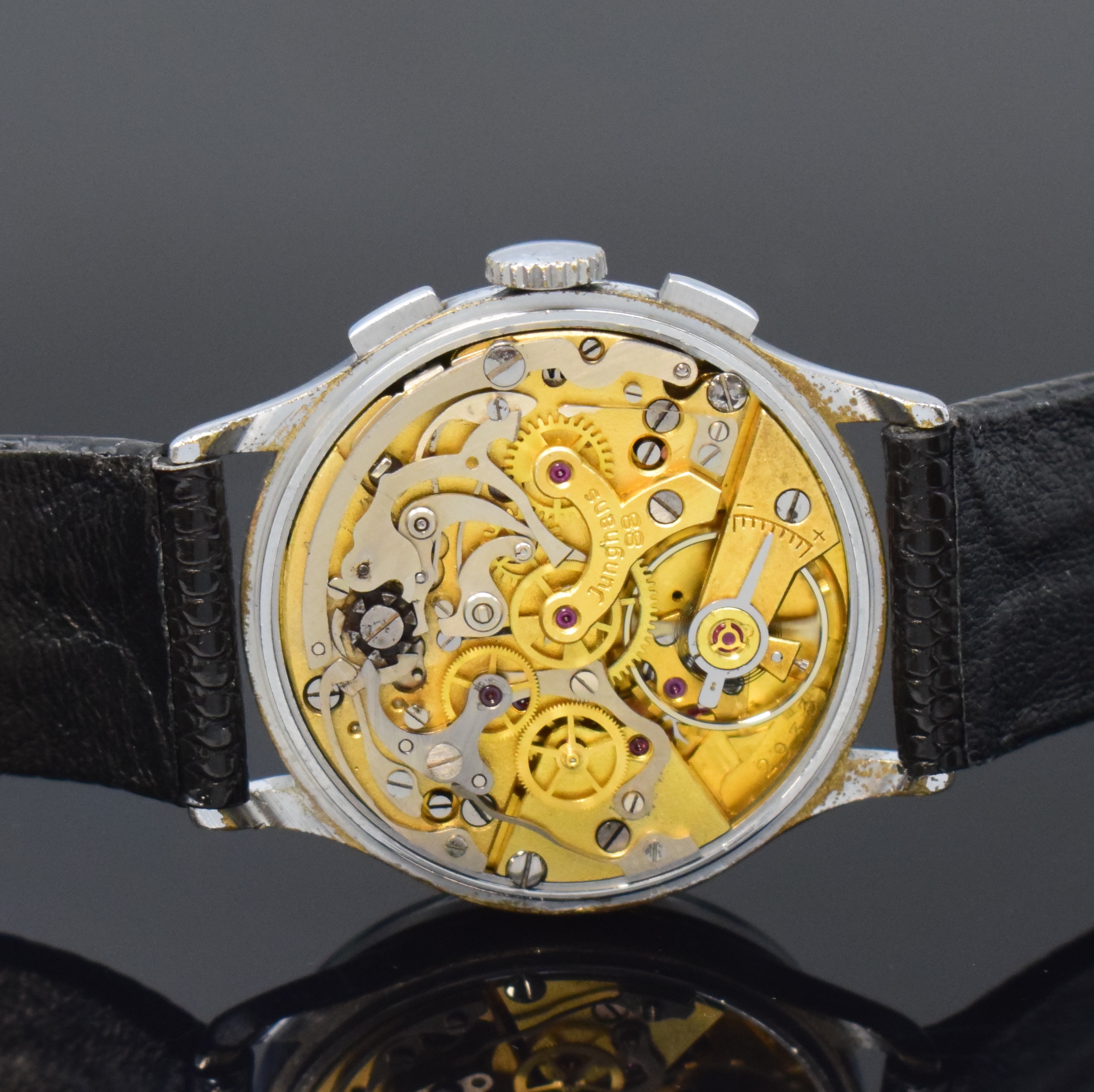 Detail d: JUNGHANS verchromter Schaltradchronograph, Deutschland um 1950, Handaufzug, neutr. Lederband m. Junghans Dornschl., Stahlboden aufgedr., schwarzes ...
