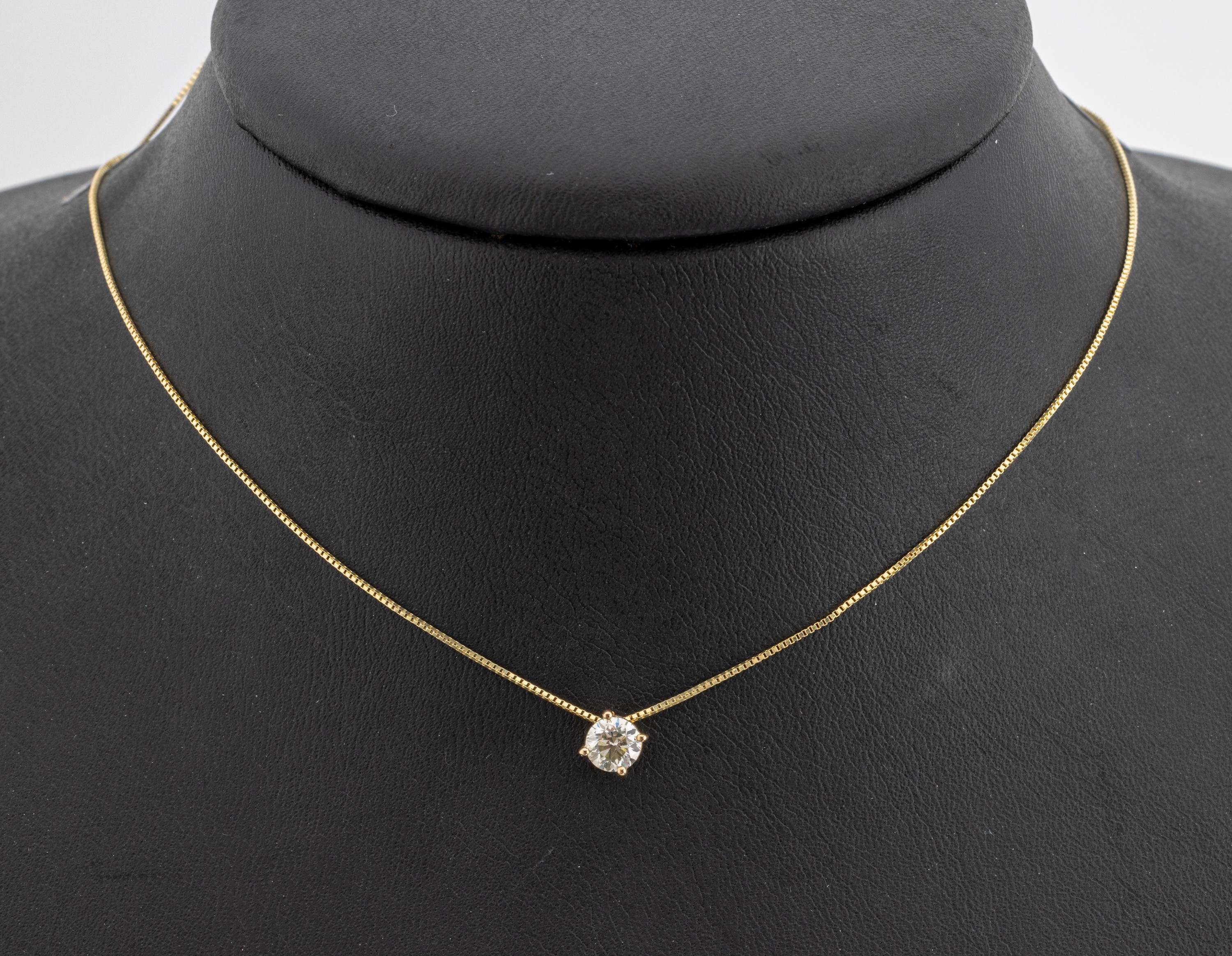 14 kt Gold Brillant-Anhänger, GG 585/000, Brillant ca. 0.48 ct Light Yellow/si1, an Kette, L. ca. 40 cm, Federringschließe, GWLAB Expertise anbei, ...