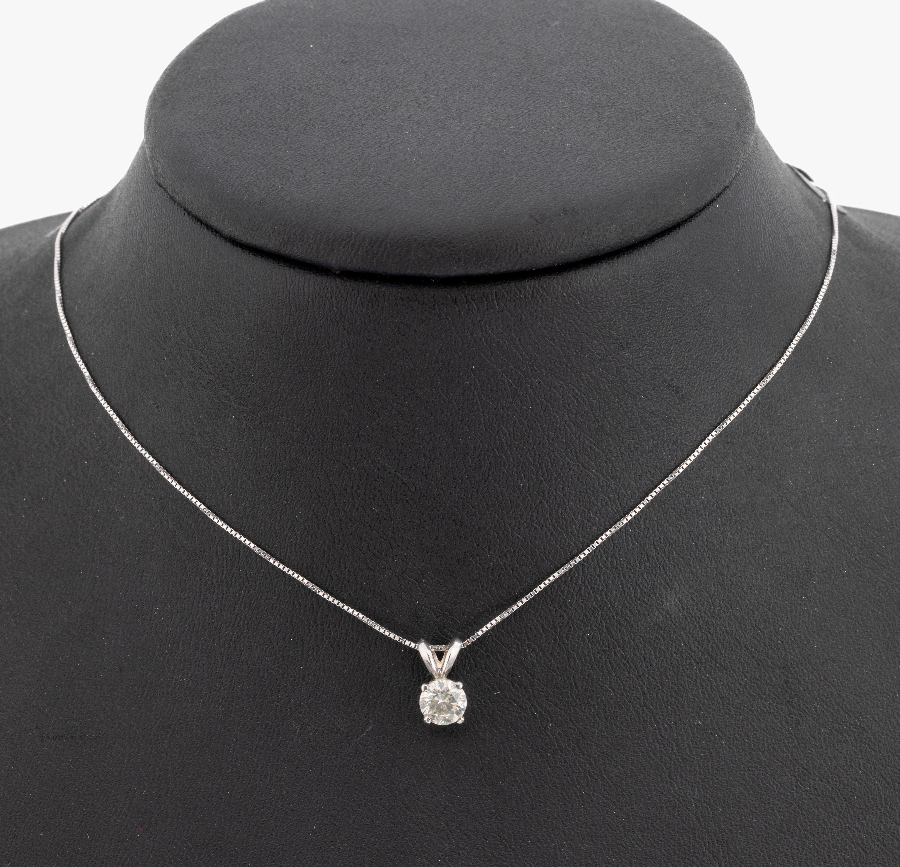 14 kt Gold Brillant-Anhänger, WG 585/000, Brillant ca. 0.62 ct Weiß-l.get.Weiß(H-I)/si2,an Kette, L. ca. 42 cm, Federringschließe, GWLAB ...